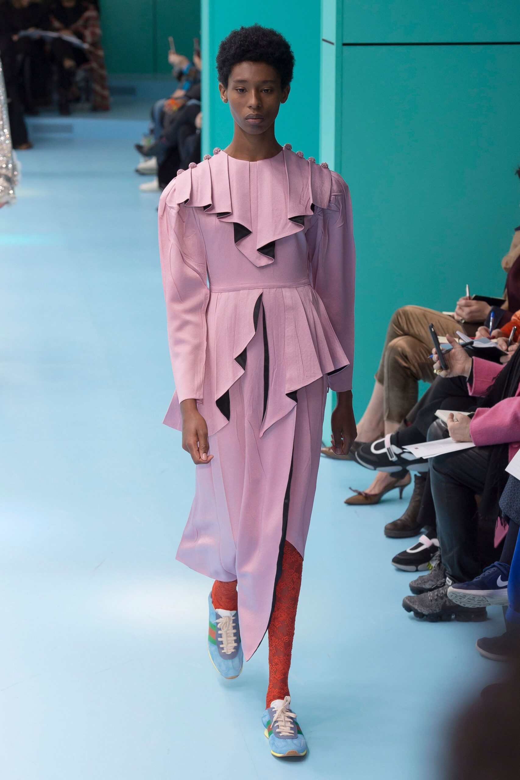 pink pleated midi dress with sneakers