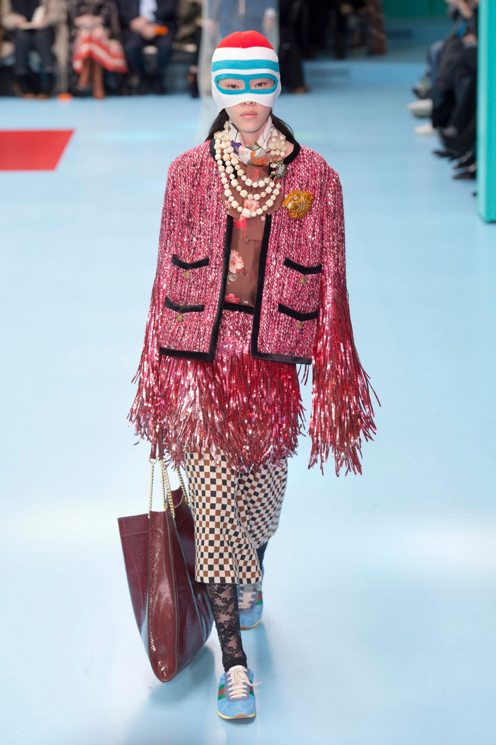 pink fringed jacket with checked pants