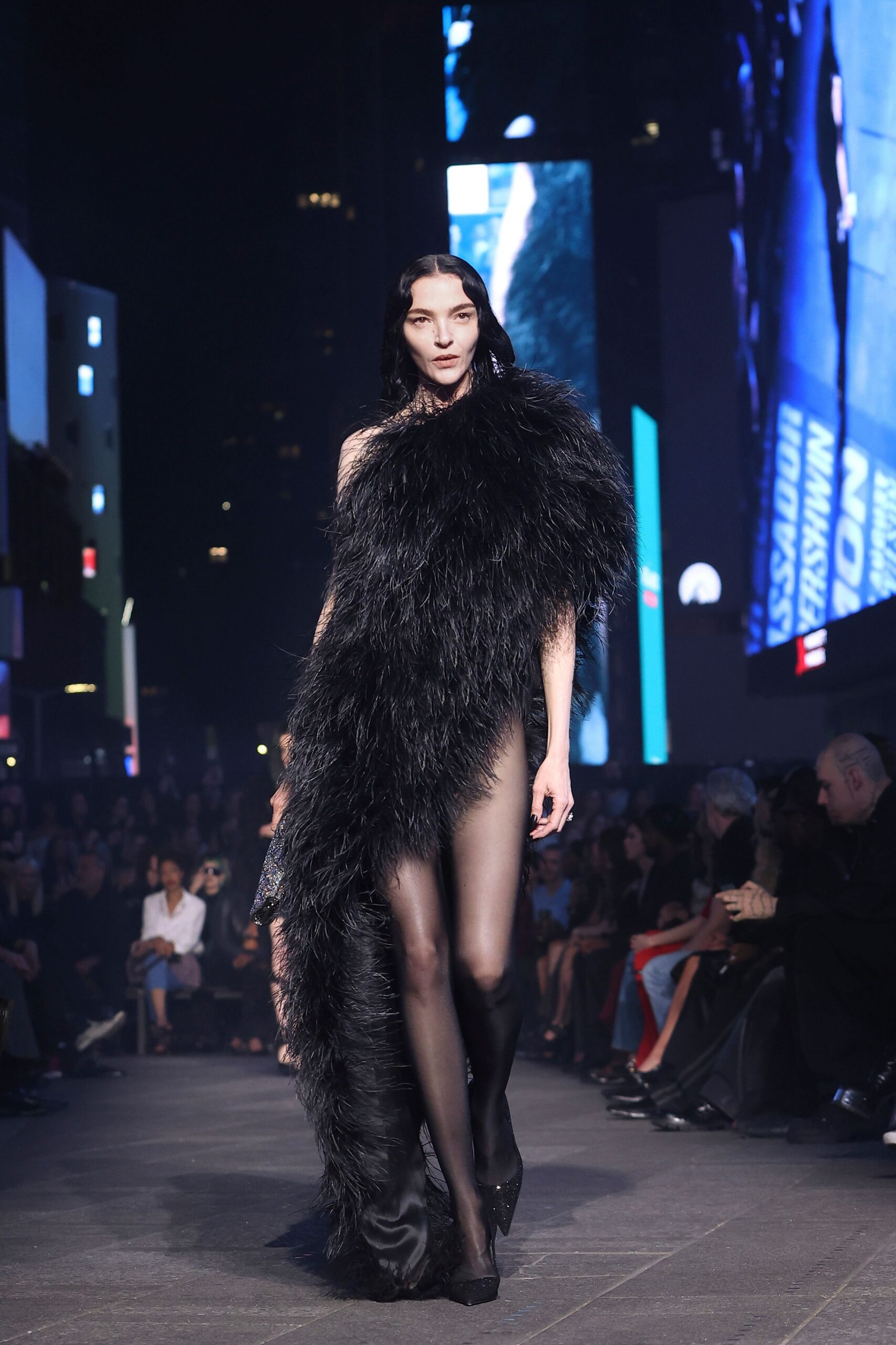black fur sleeveless high-neck fitted draped flowing gown
