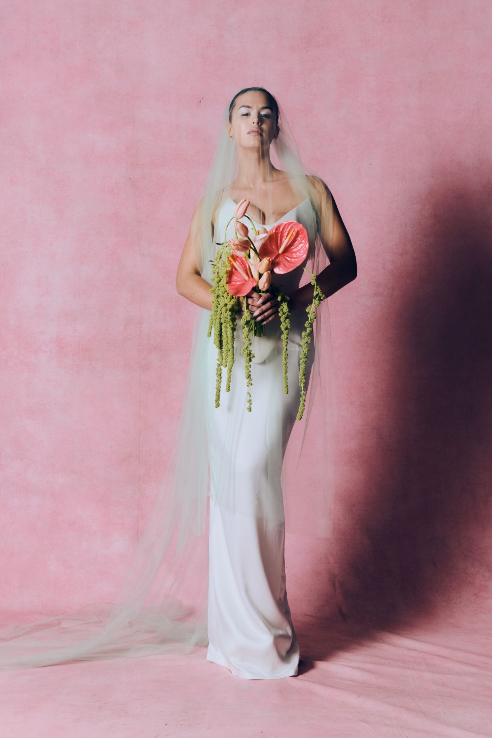 white silk fitted gown with veil