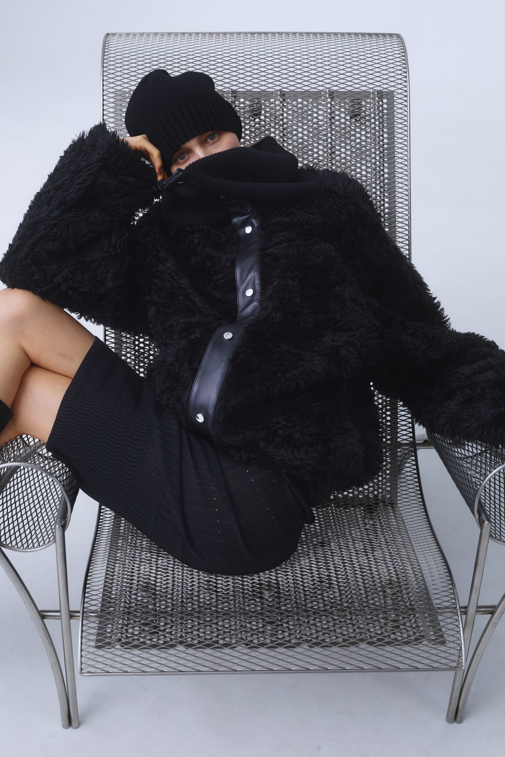 black faux-fur jacket with mini skirt