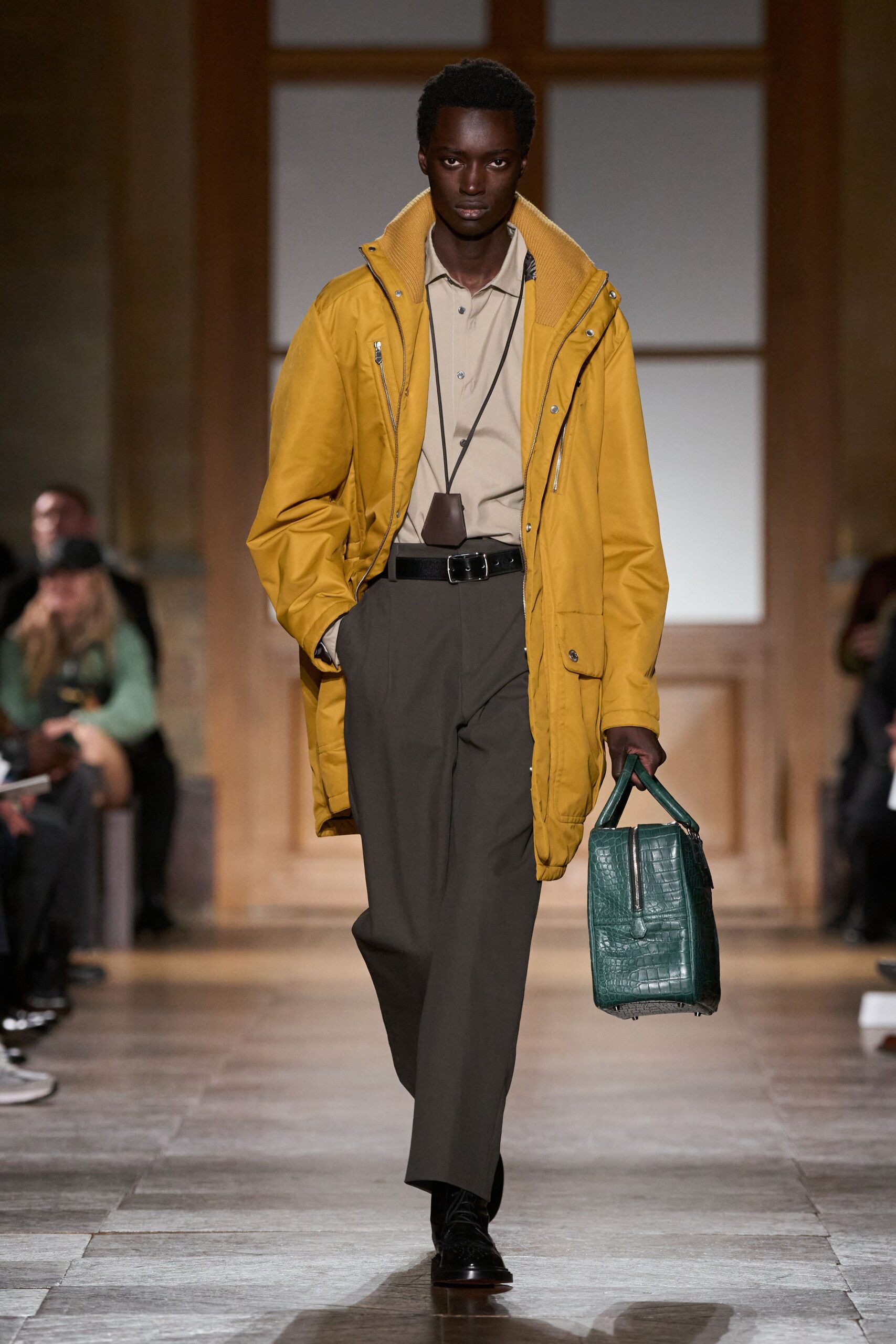 yellow parka beige shirt gray pants