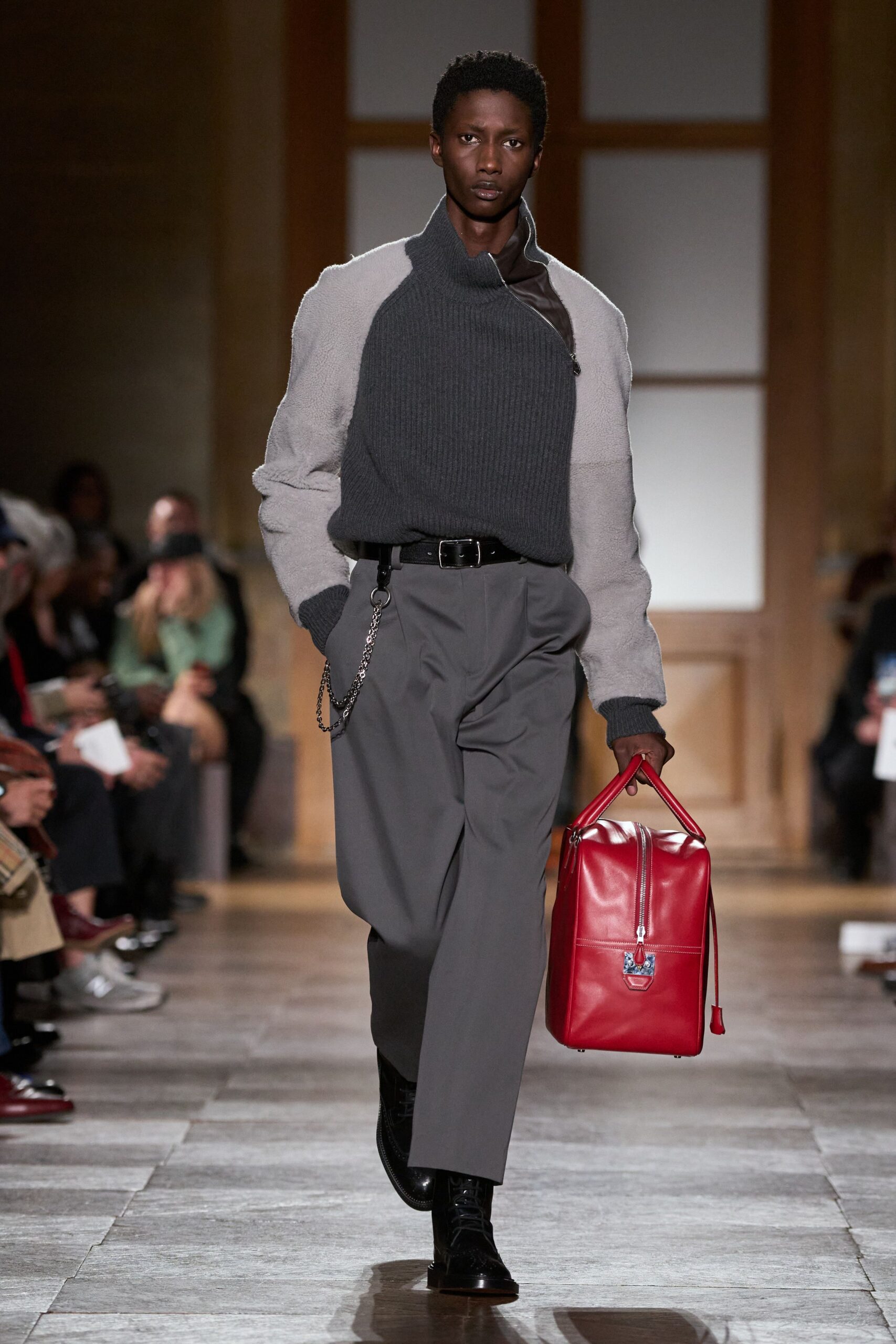 gray sweater brown shirt gray pants black shoes red bag