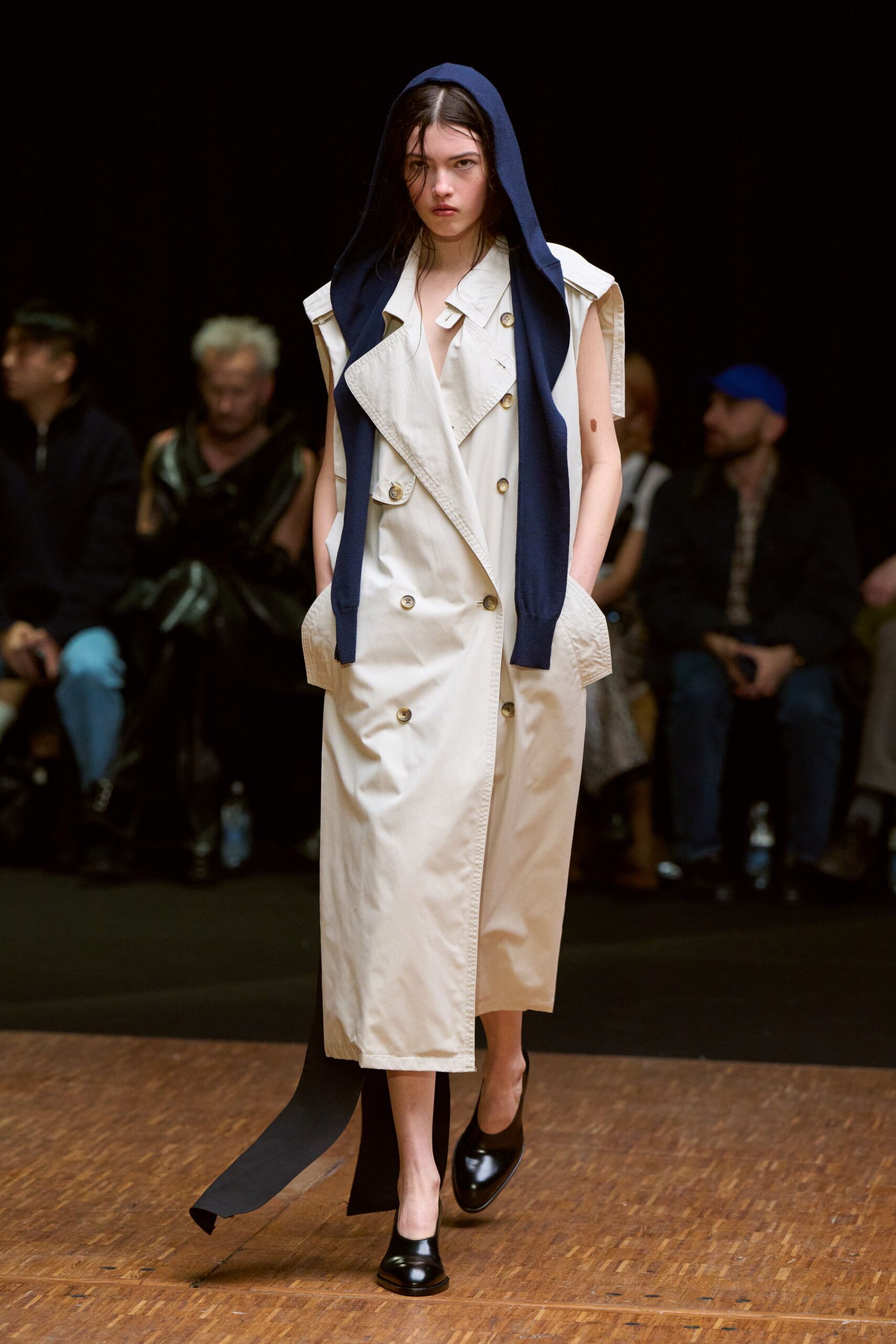 beige trench coat with navy hoodie