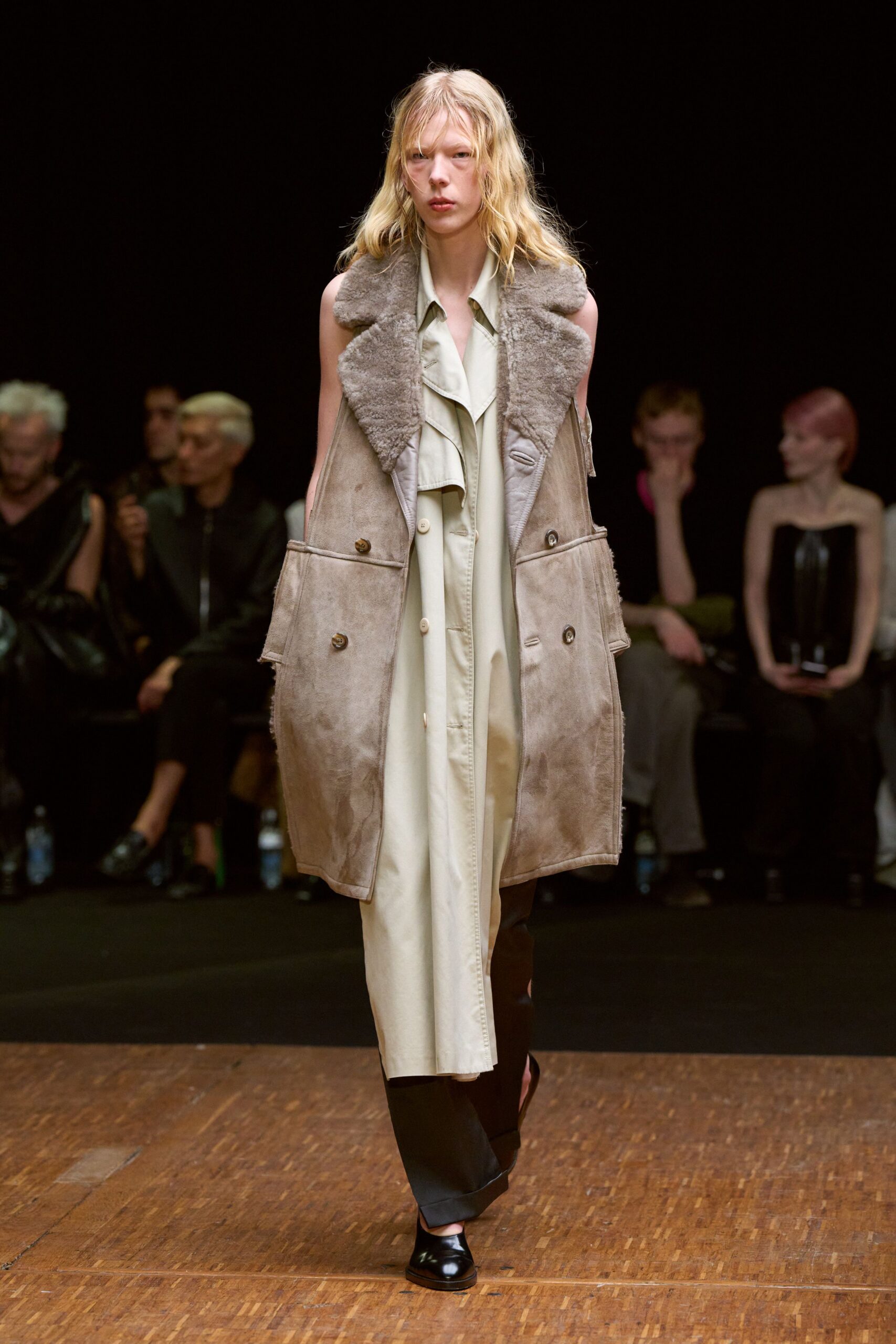 beige suede coat over green dress