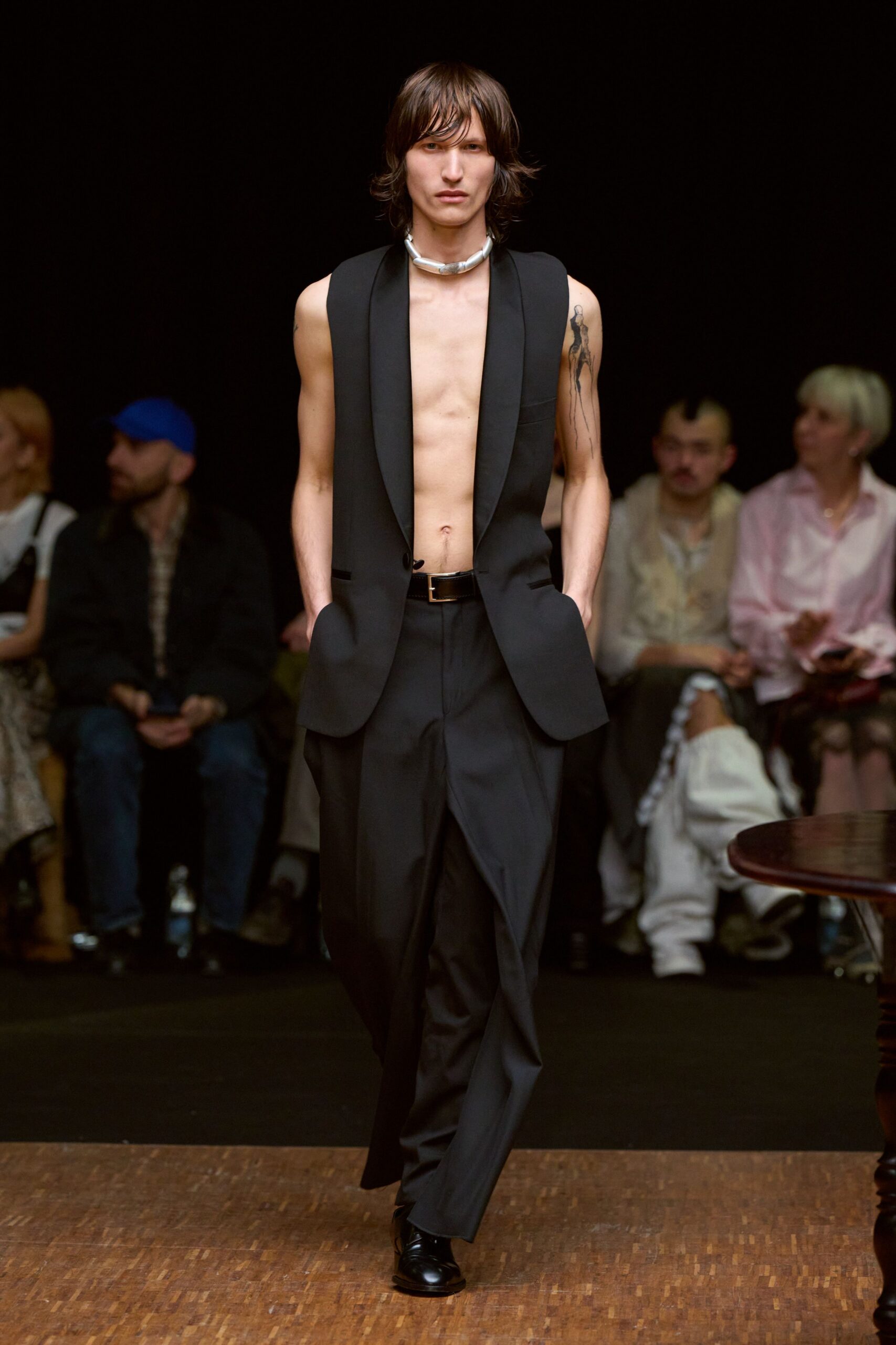 black fitted suit with sleeveless top