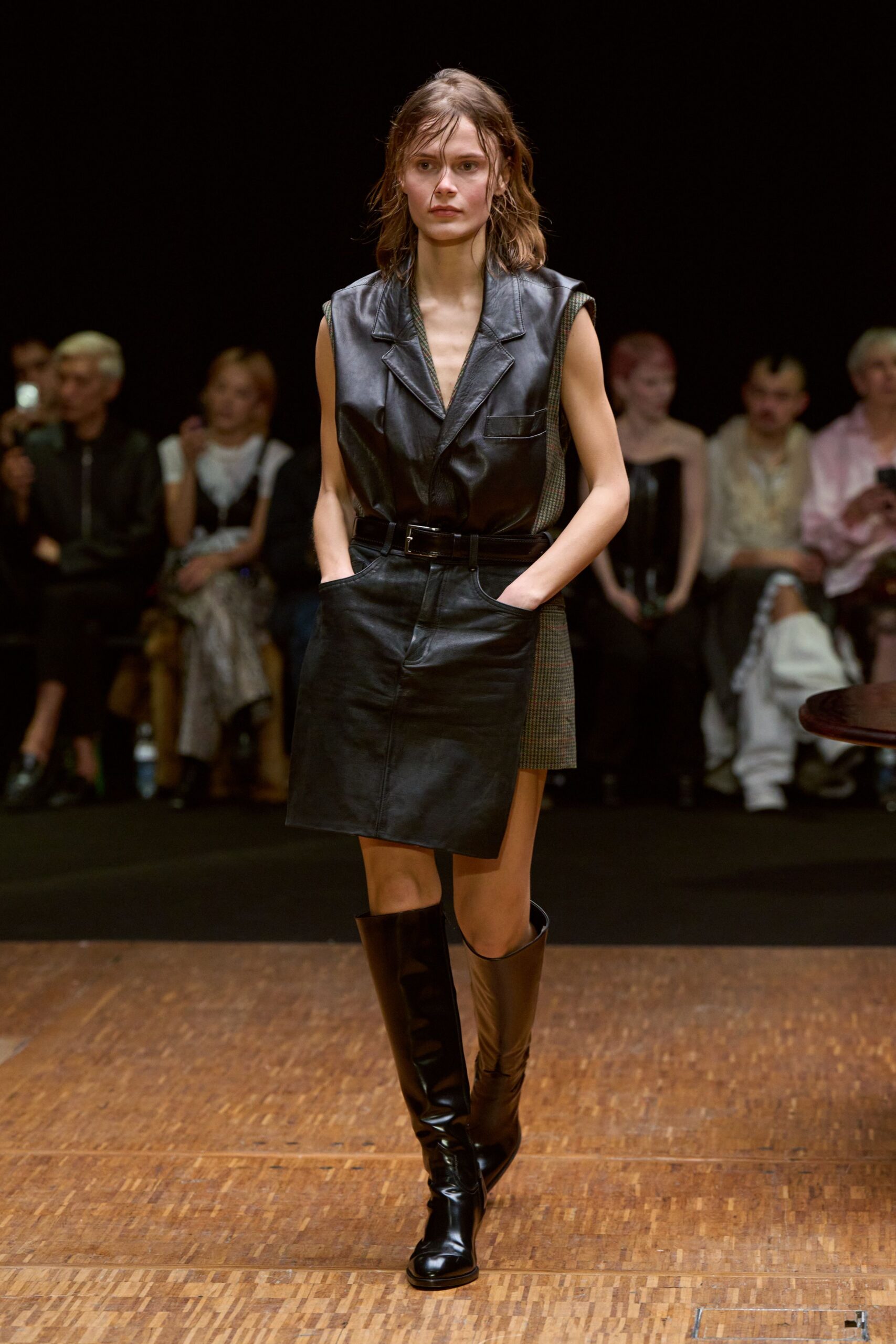 black leather sleeveless dress with boots