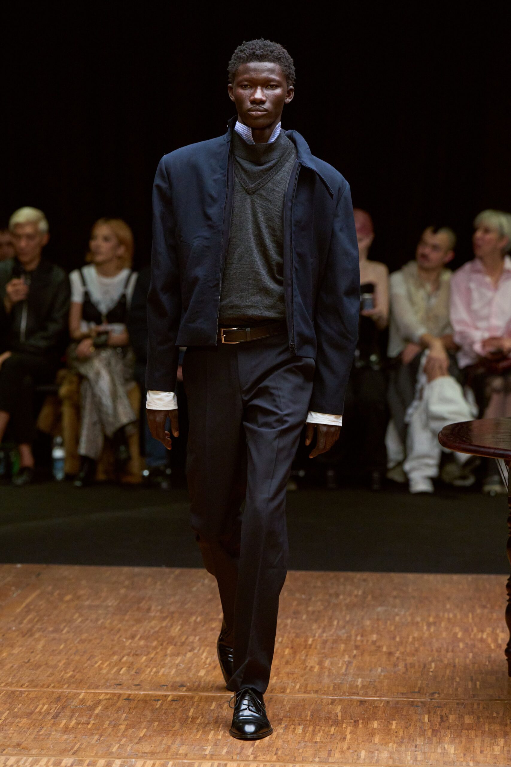 black jacket gray sweater tailored pants