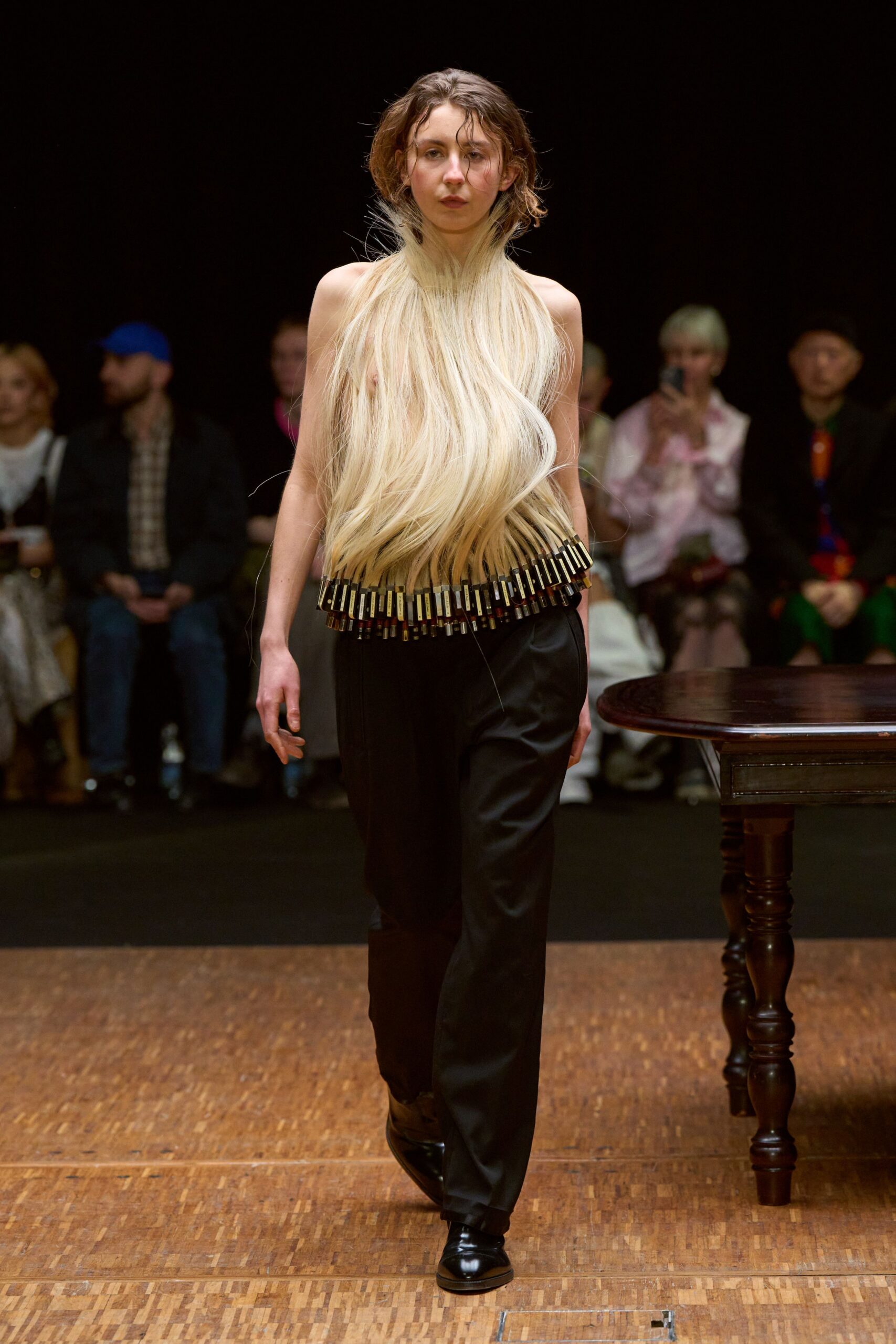 black relaxed pants and white pleated top