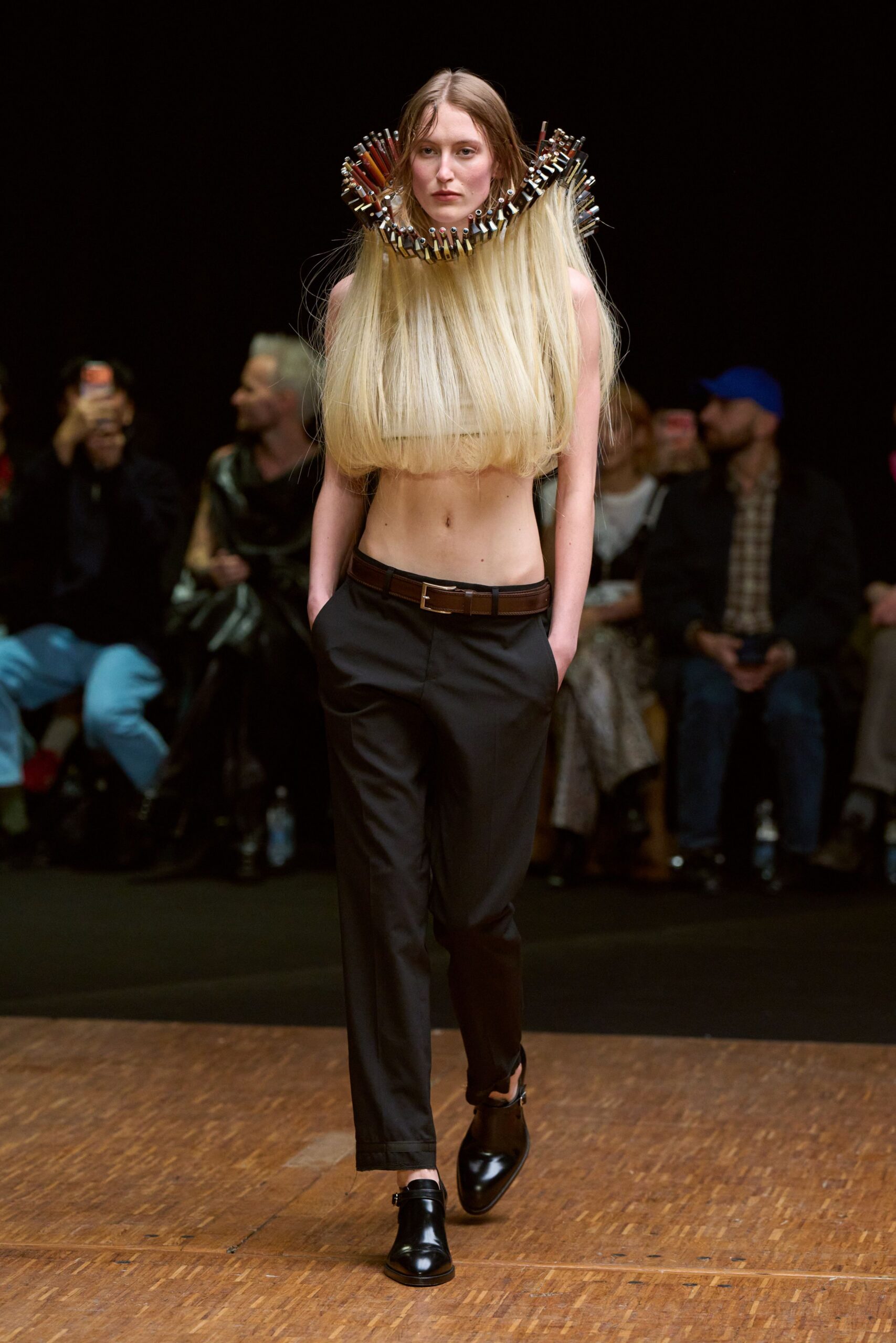 beige cropped top with black pants