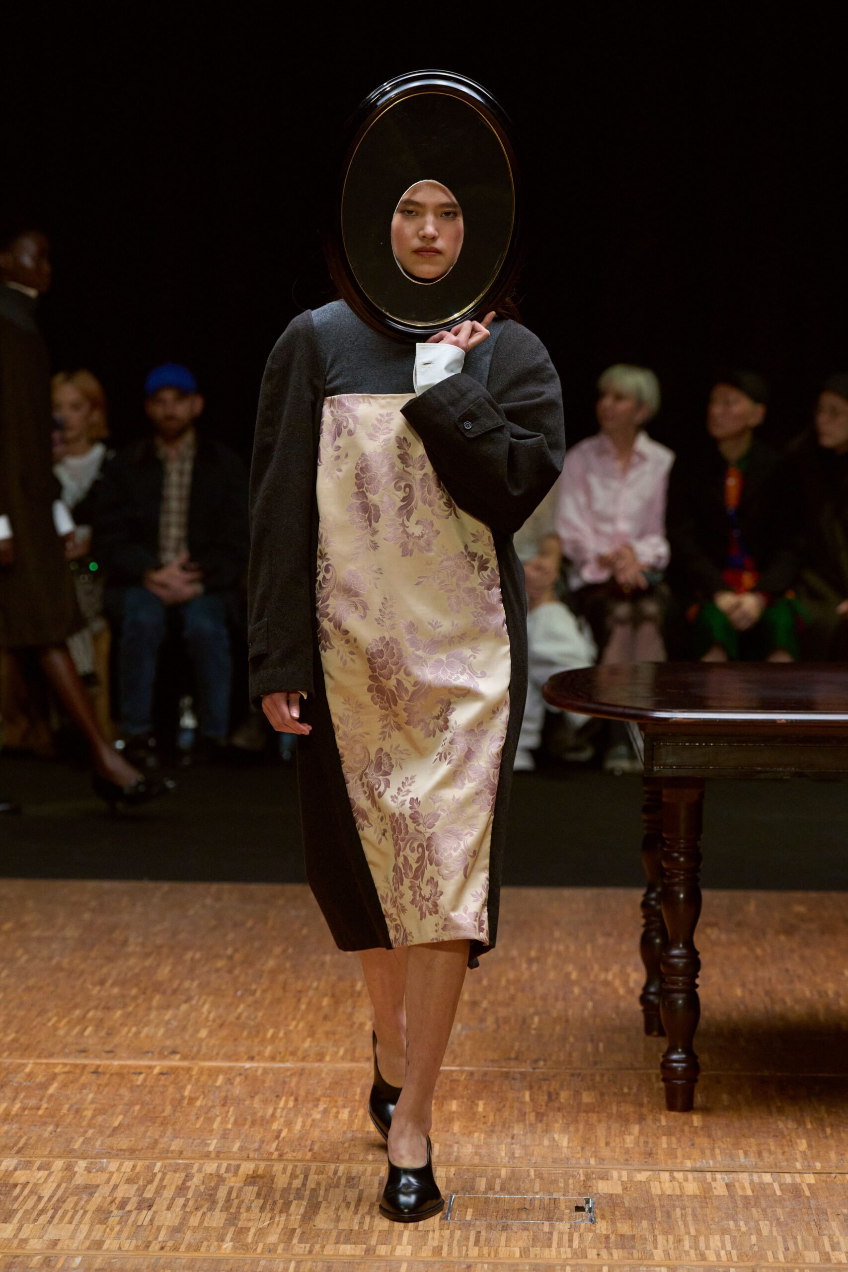 black coat with beige floral dress