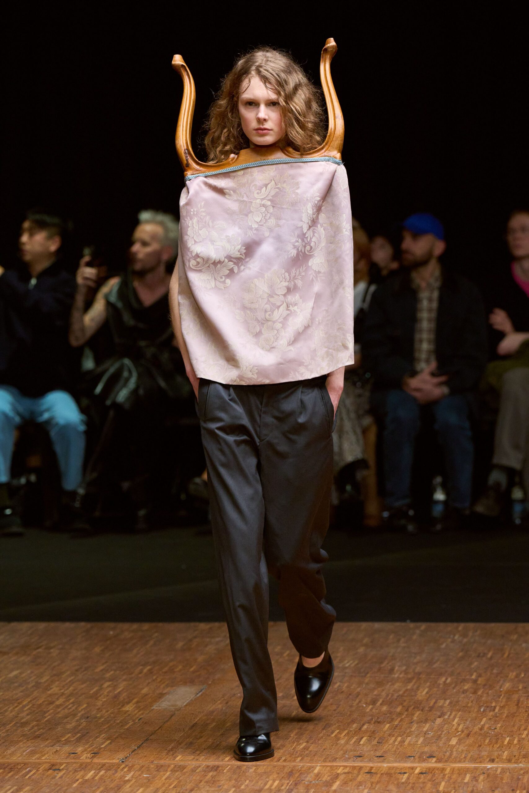 pink embroidered top with black pants