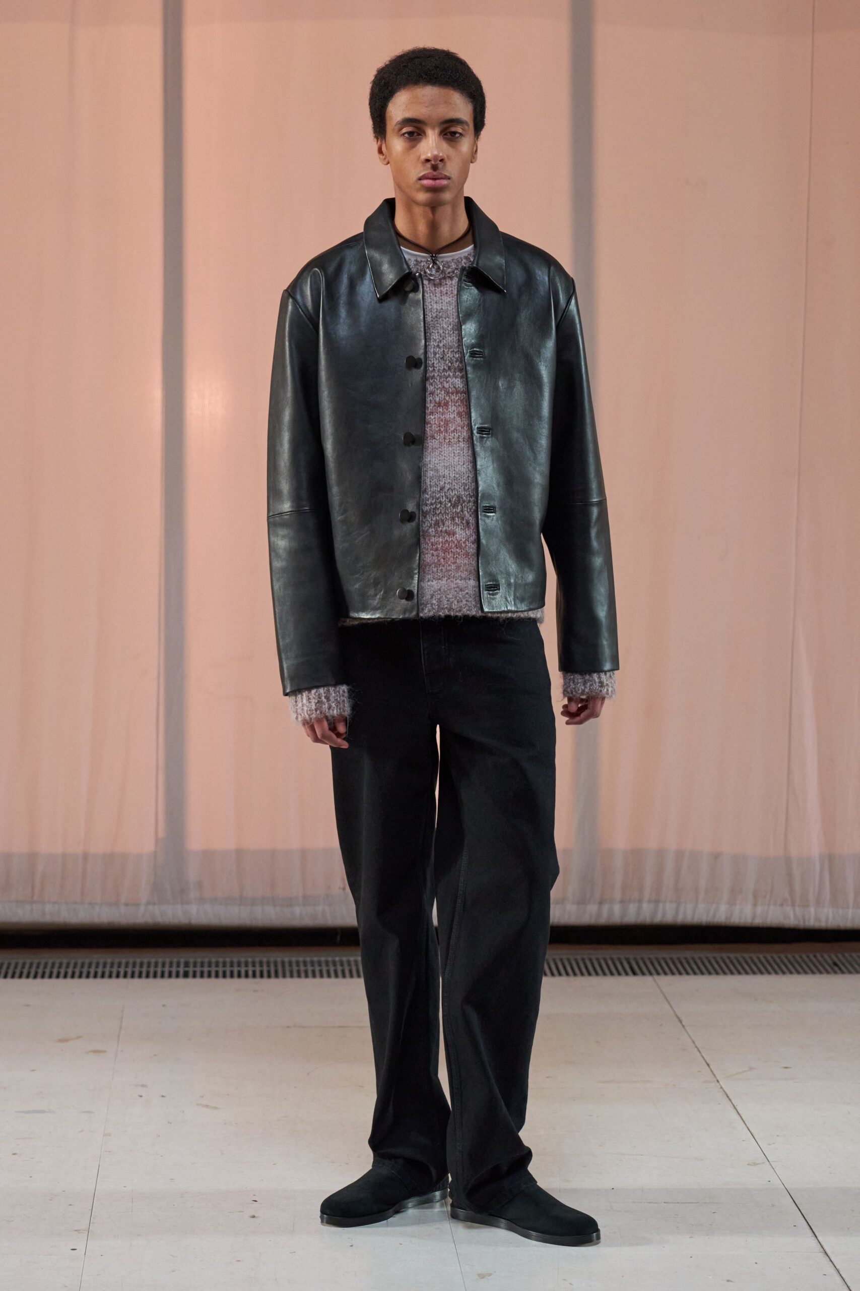 black leather jacket with gray sweater