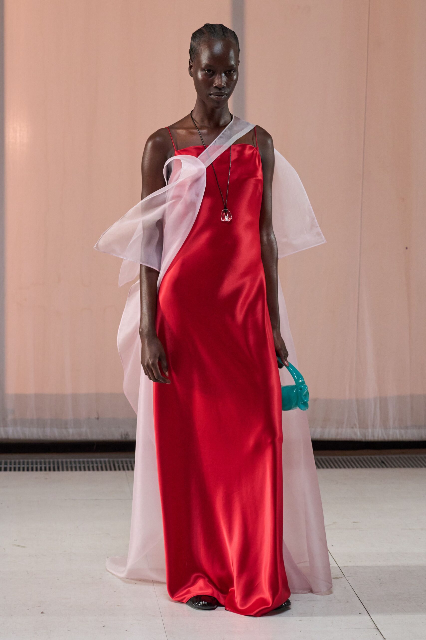 red silk sleeveless v-neck fitted draped flowing gown