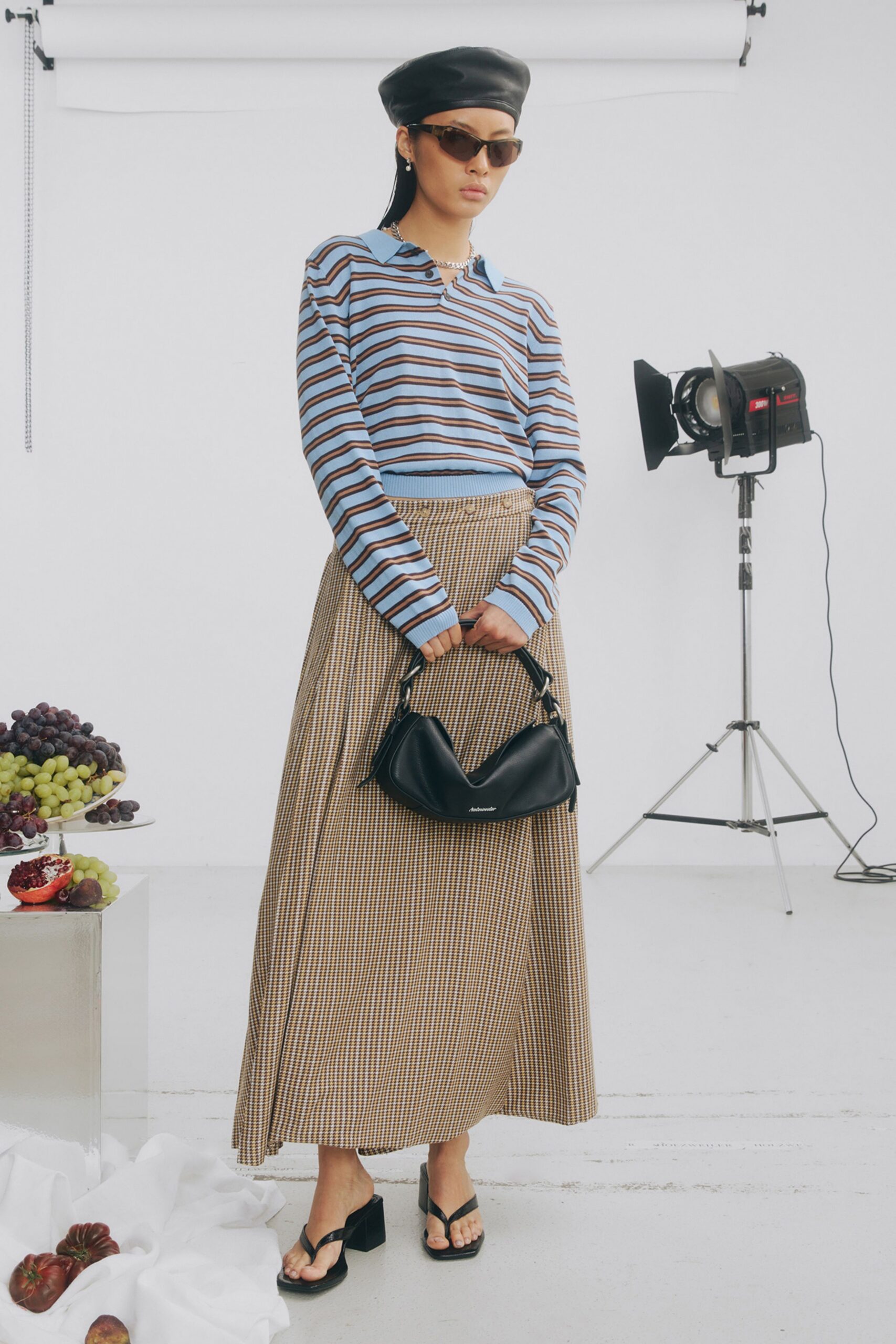 striped top and pleated skirt