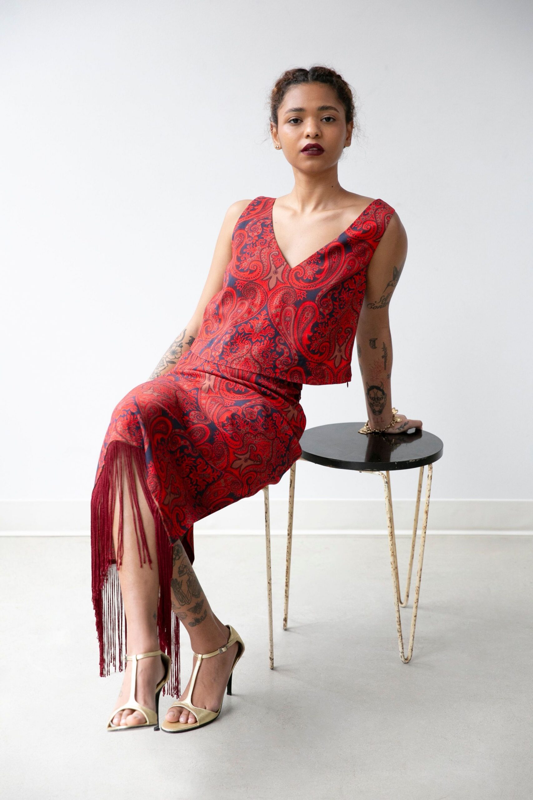 red silk sleeveless v-neck fitted fringed midi dress