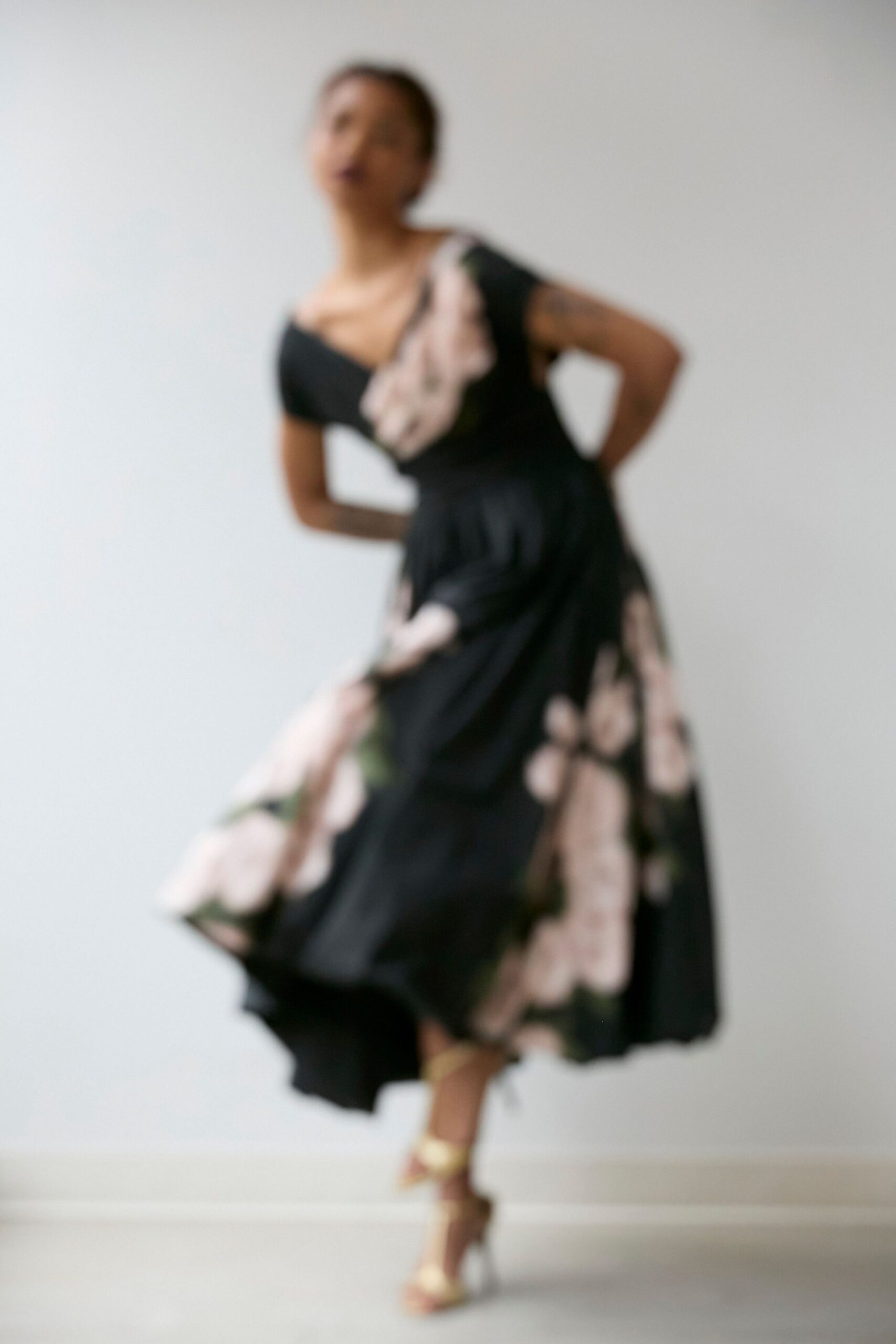 black cotton short-sleeve v-neck fitted floral a-line dress