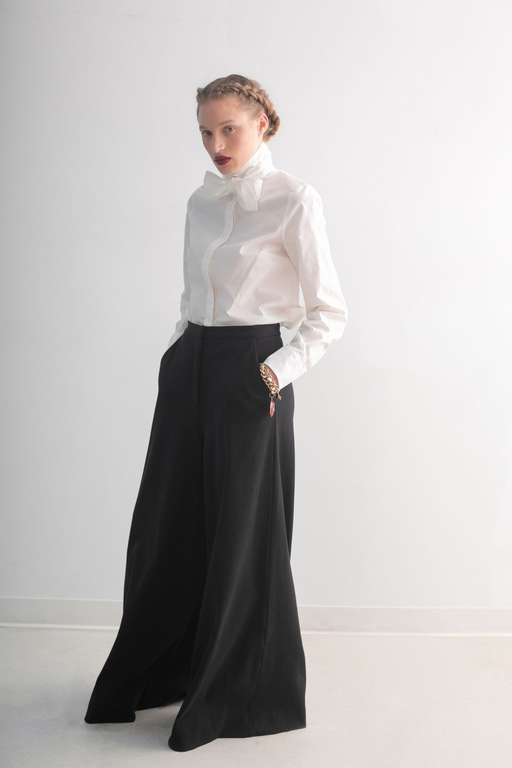 white fitted shirt and black wide-leg pants