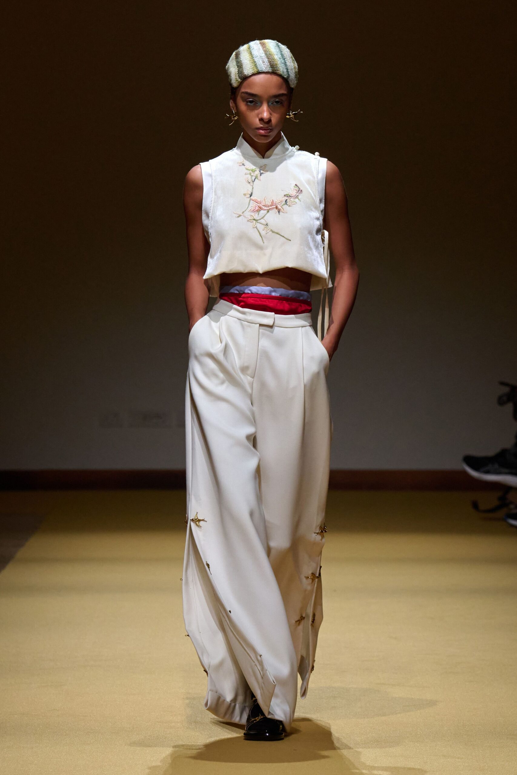 white fitted top with beige pants
