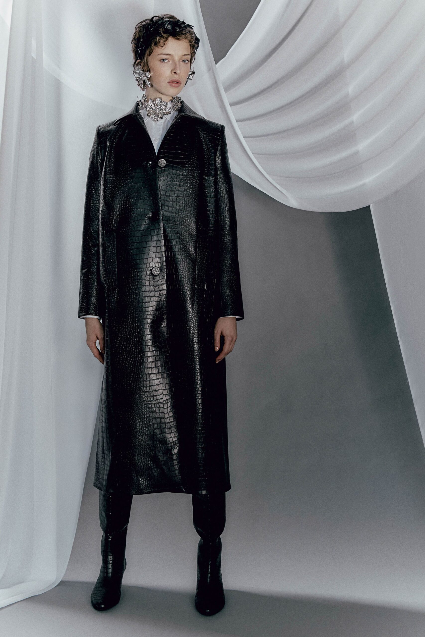 black leather long-sleeve collared fitted buttoned textured coat