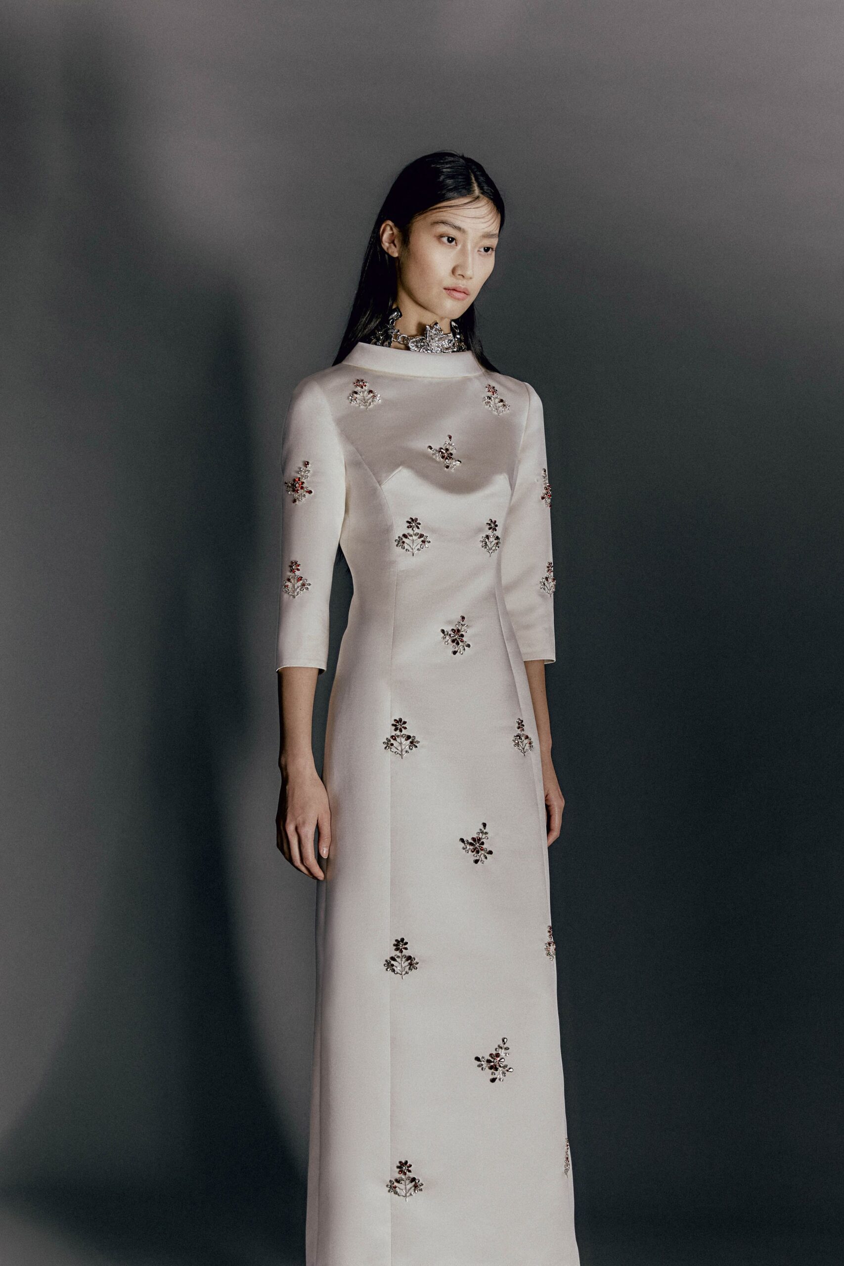 white silk embroidered gown