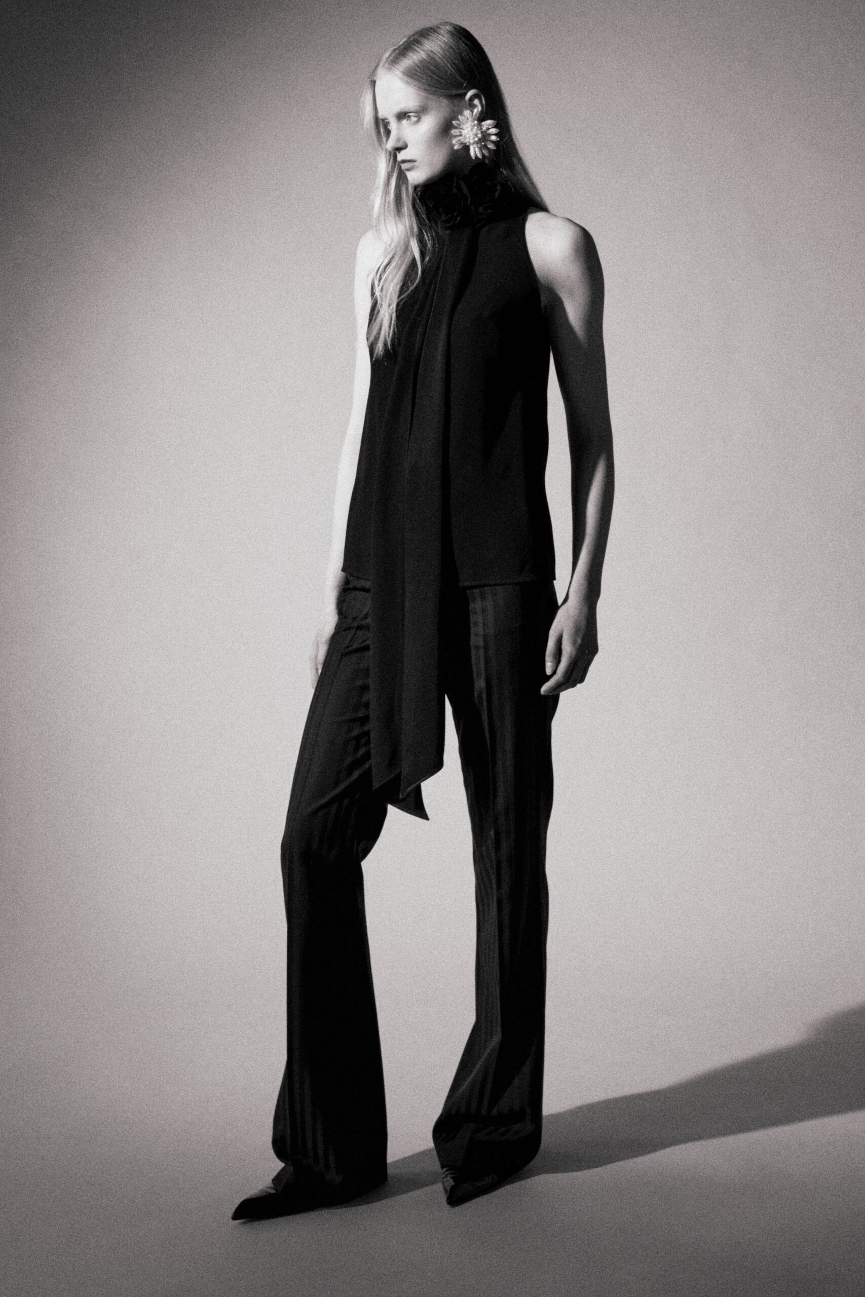 black silk sleeveless high-neck fitted draped top