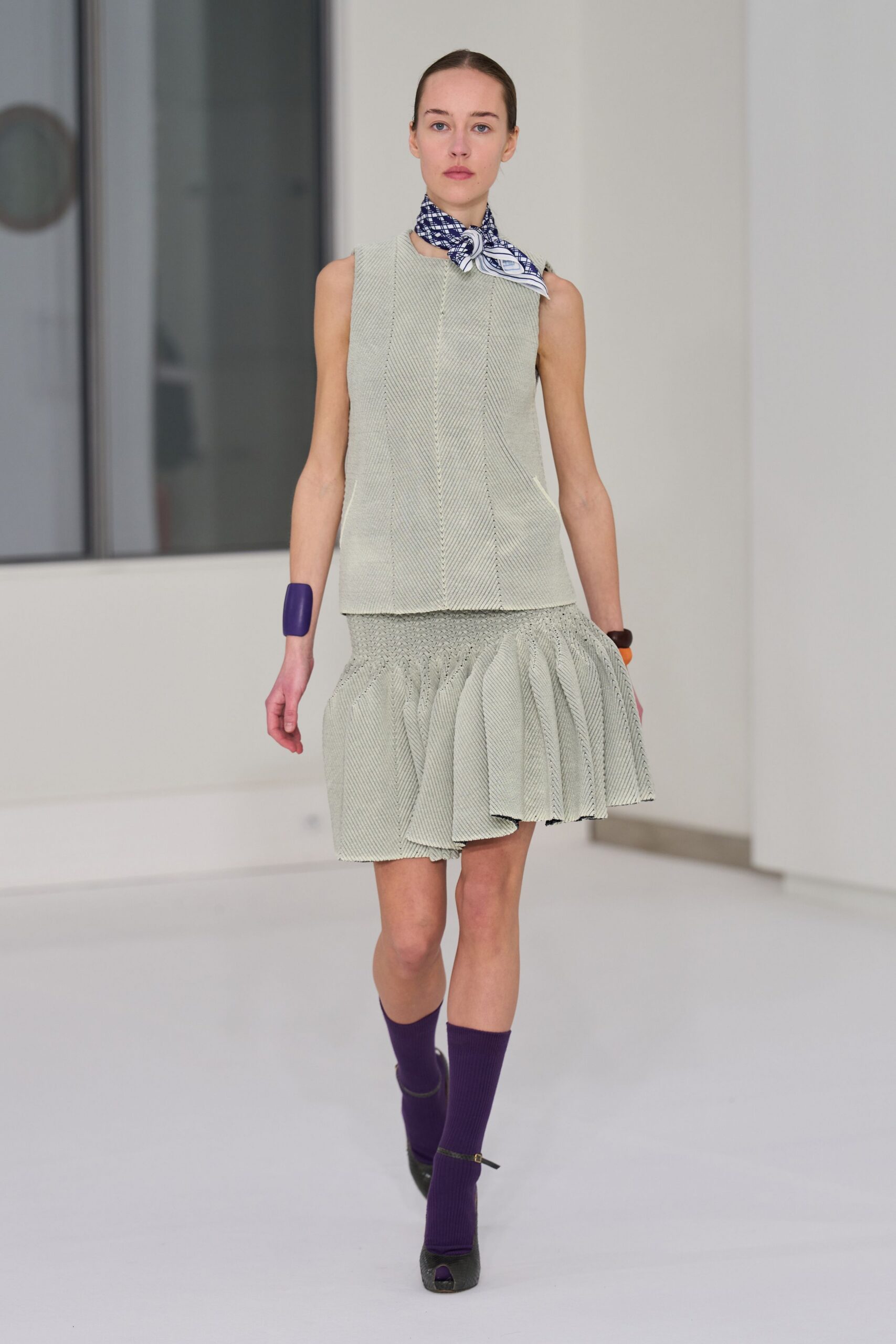 green cotton sleeveless high-neck fitted pleated top