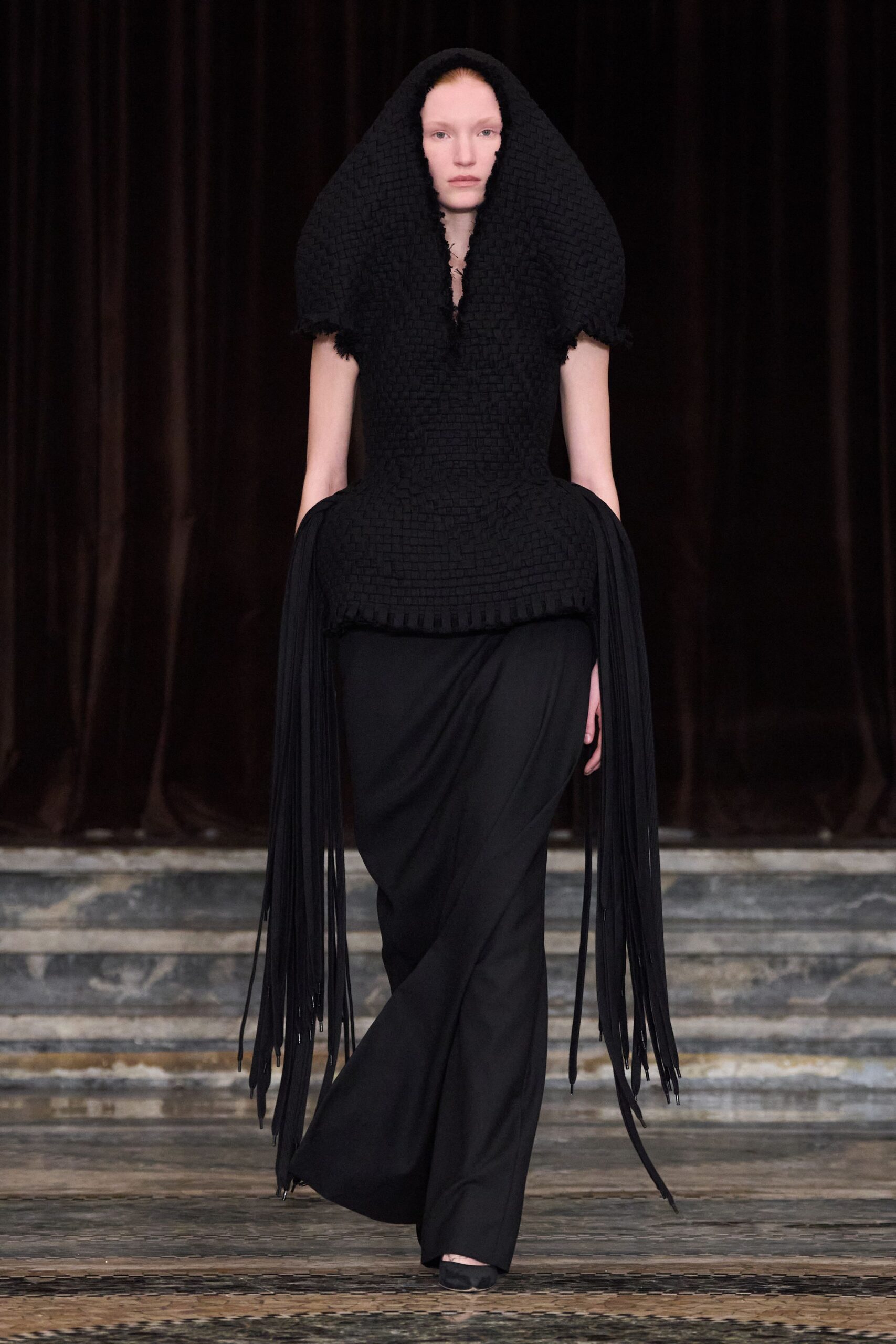 black fitted top with fringes