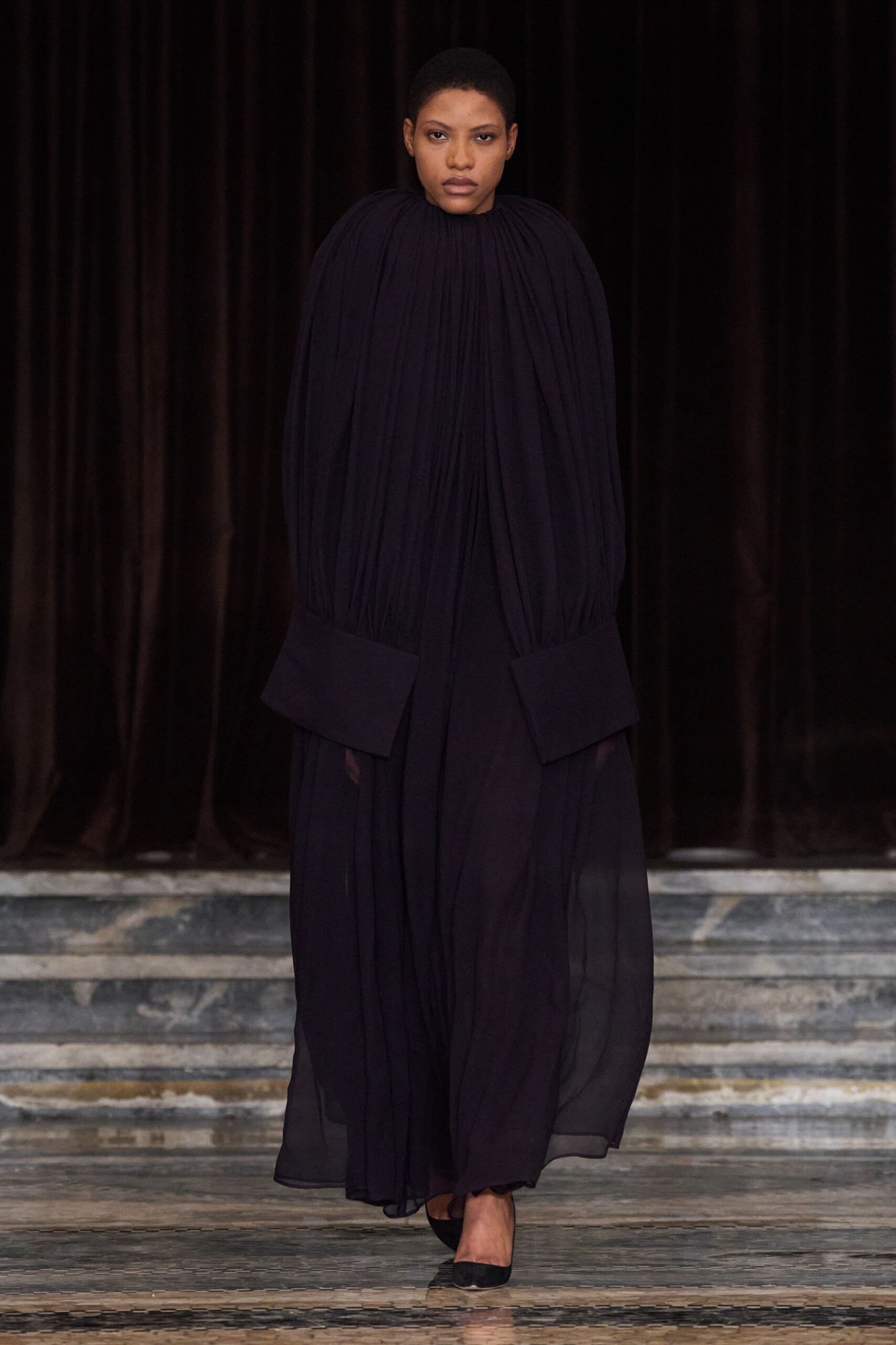 black pleated silk gown with heels