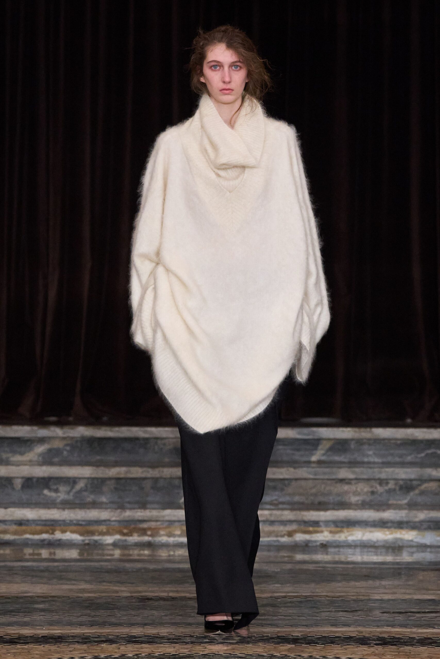 white oversized poncho with black pants