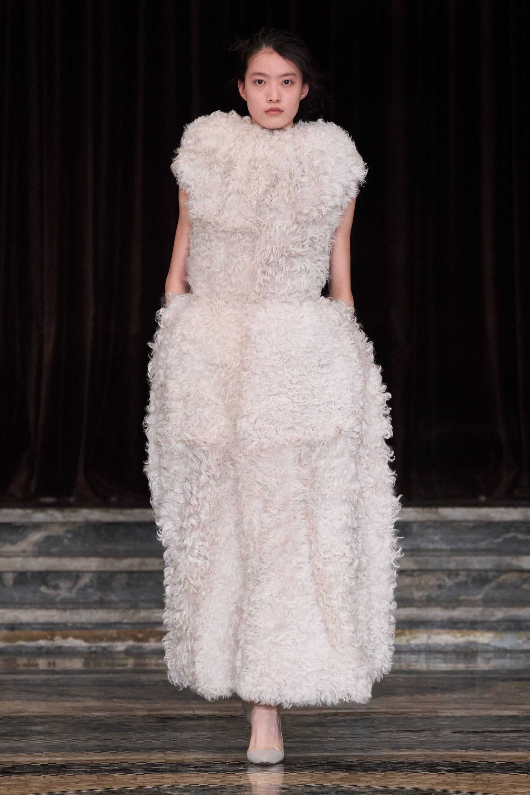 white fur sleeveless gown