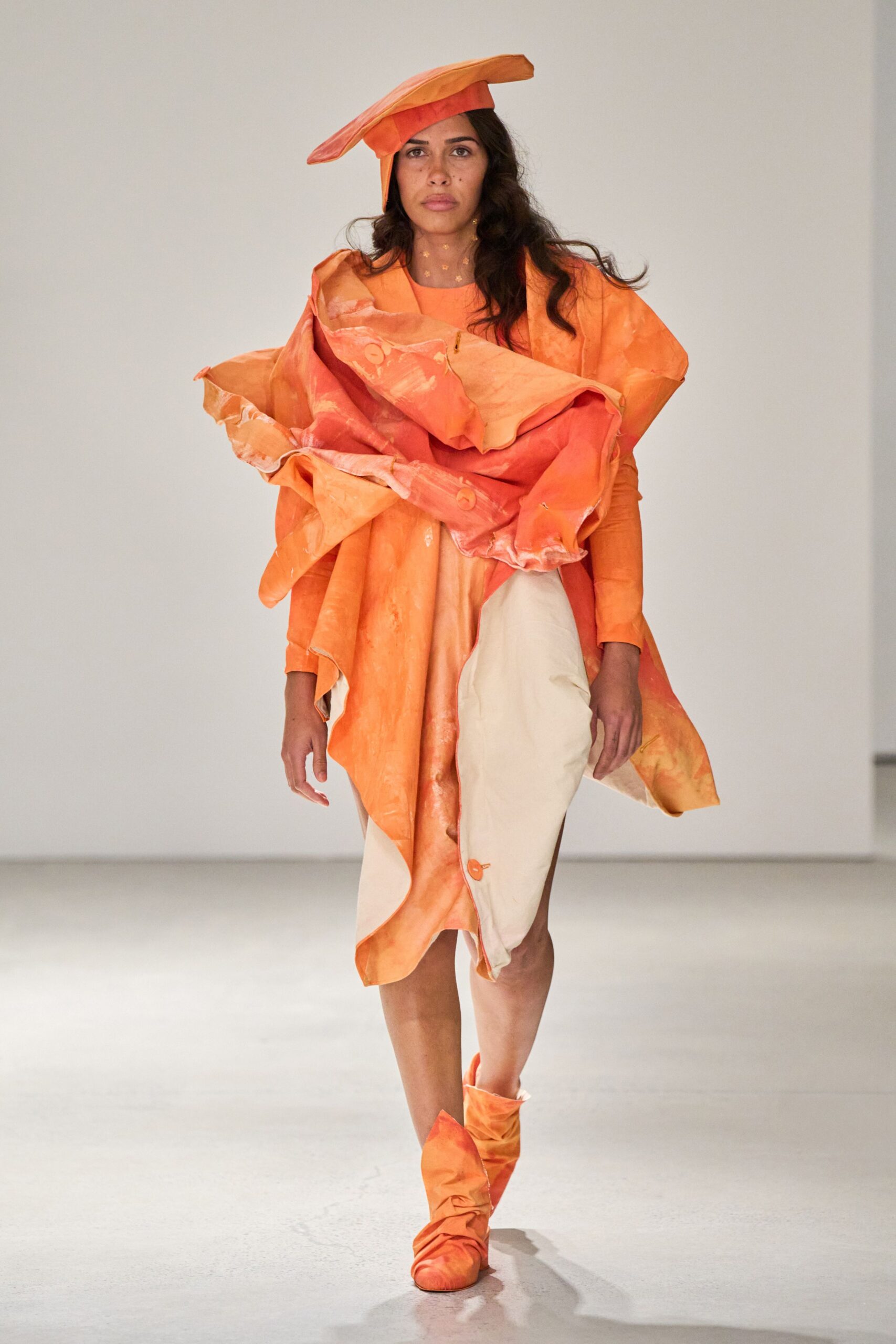 orange draped midi dress with hat