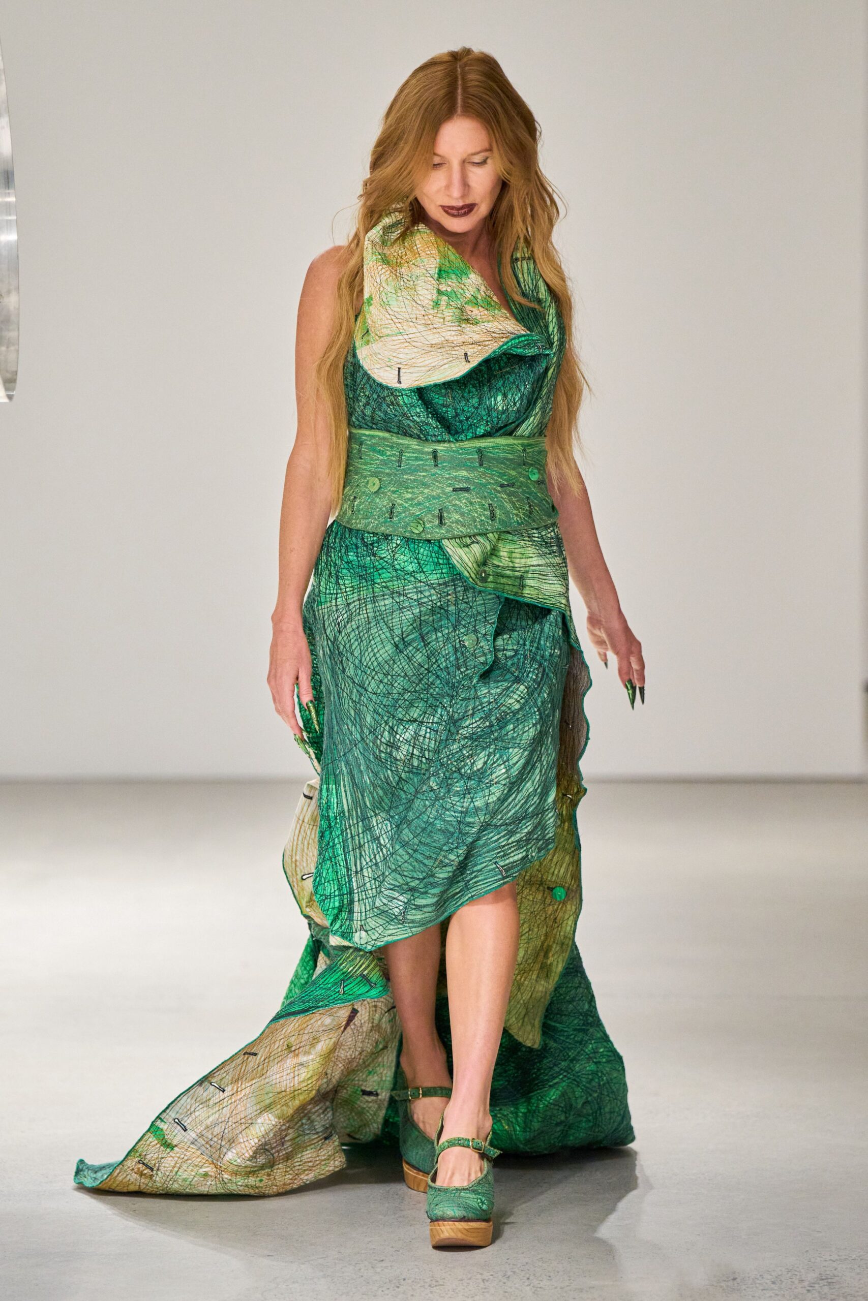 green silk sleeveless v-neck fitted draped layered gown
