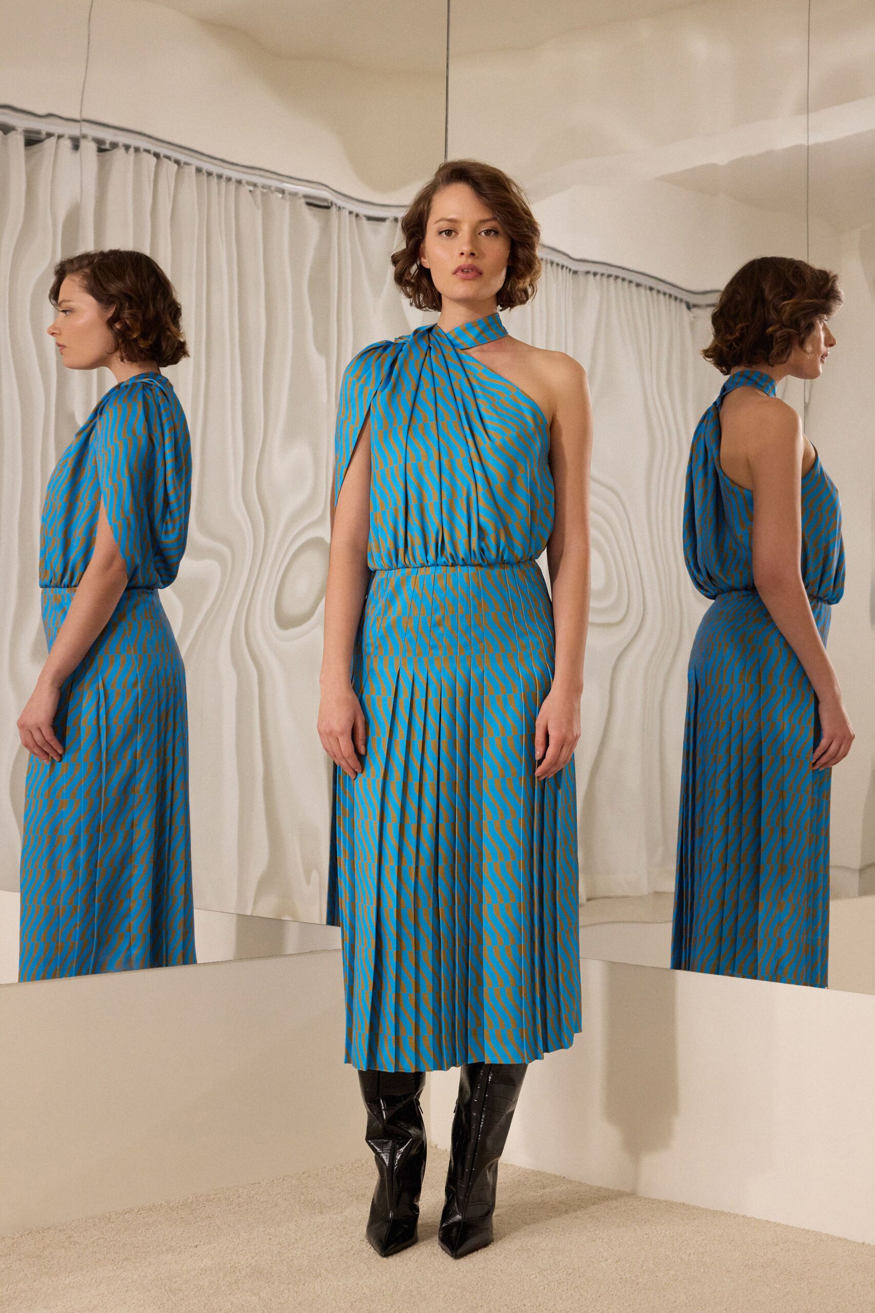 blue green pleated midi dress with boots