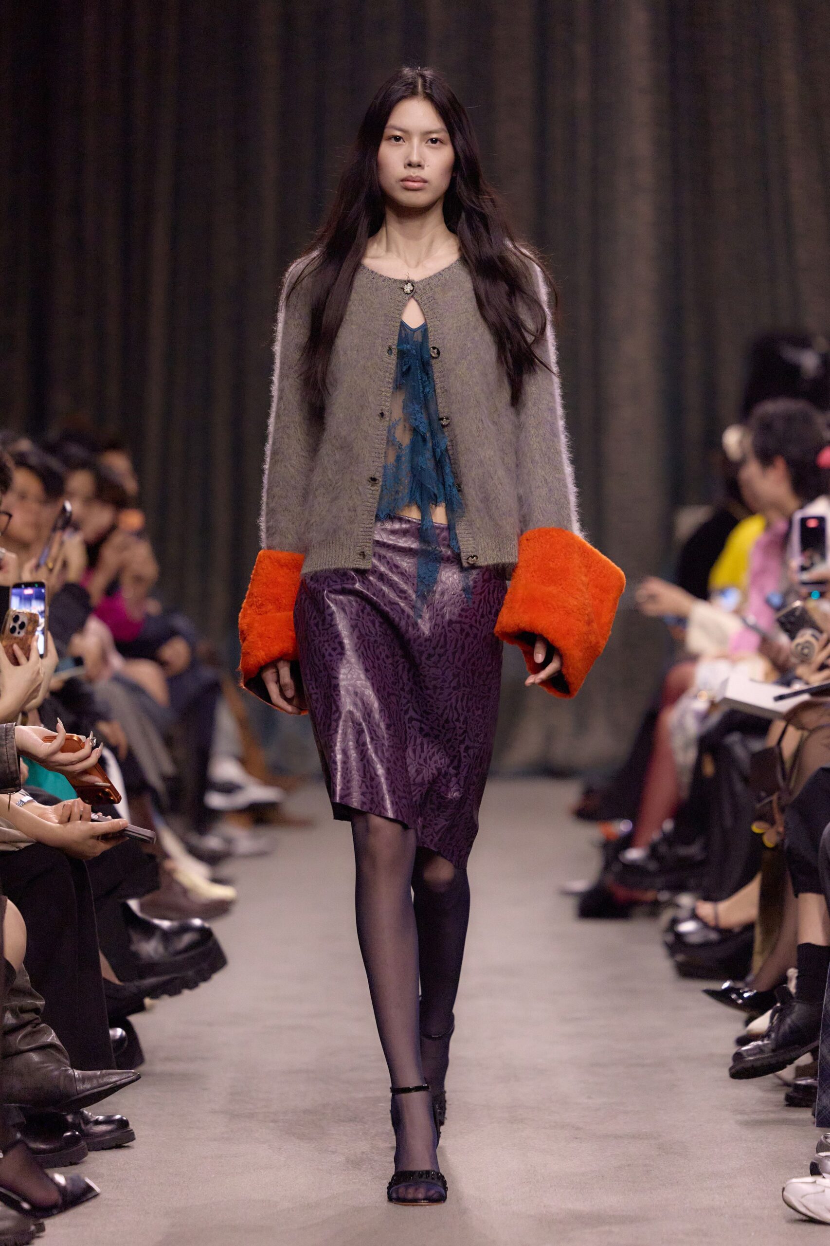 gray cardigan with orange sleeves