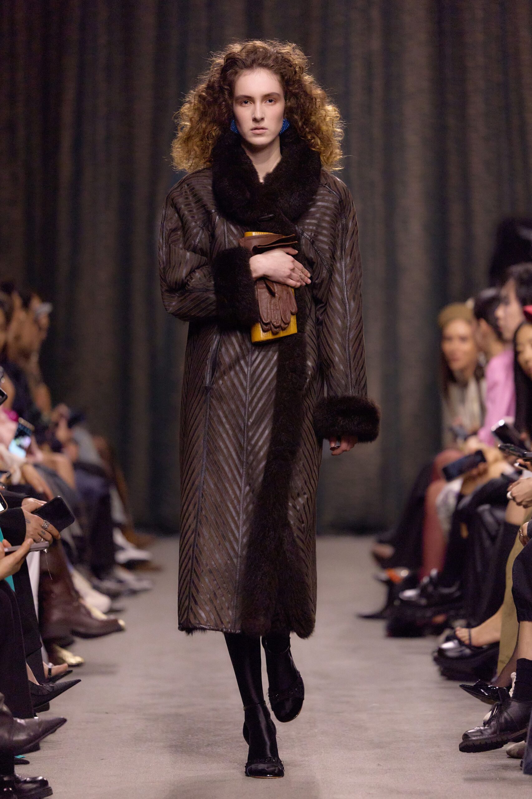 brown leather coat with gloves and bag
