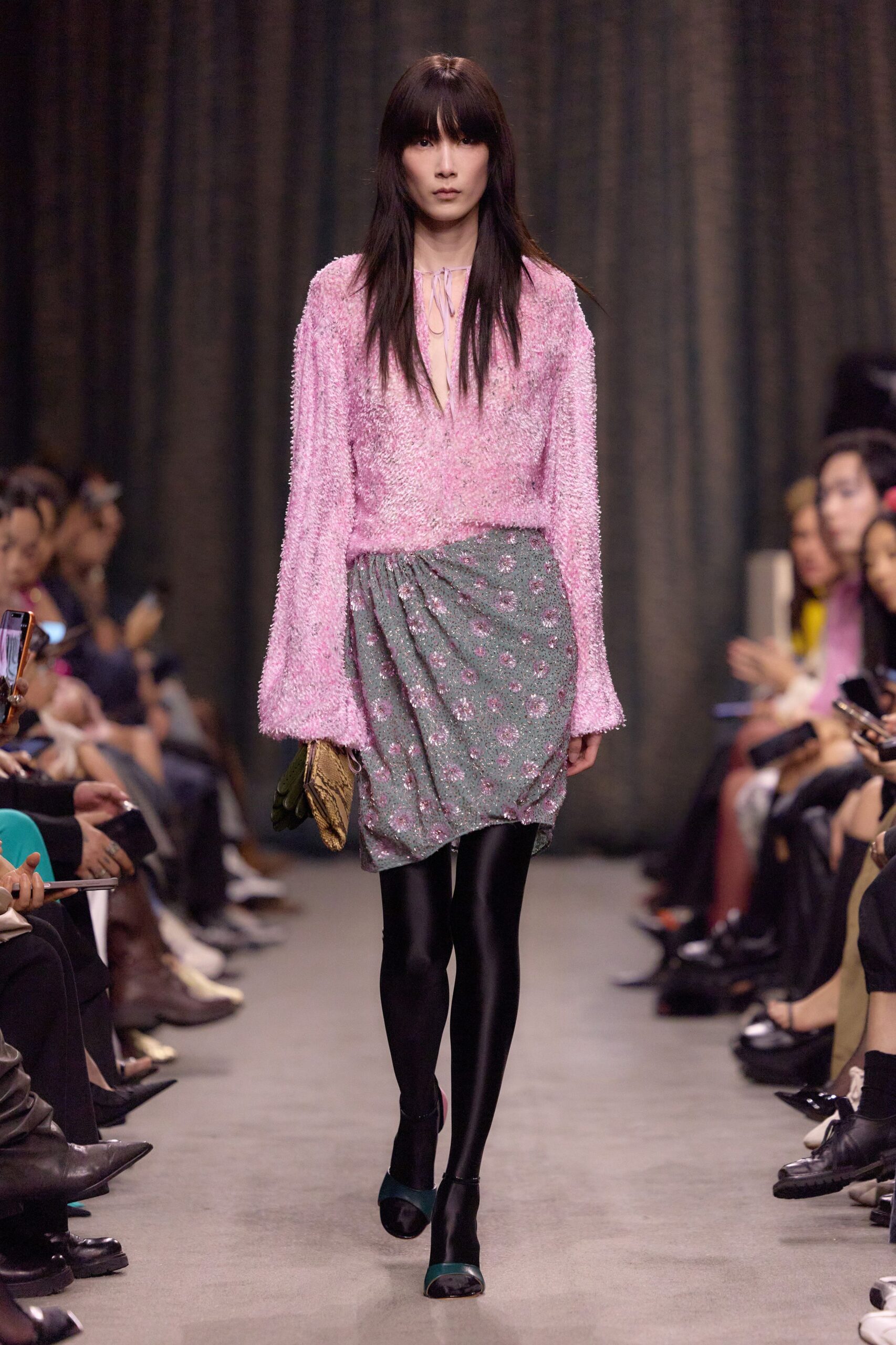 pink ruffled top with gray skirt