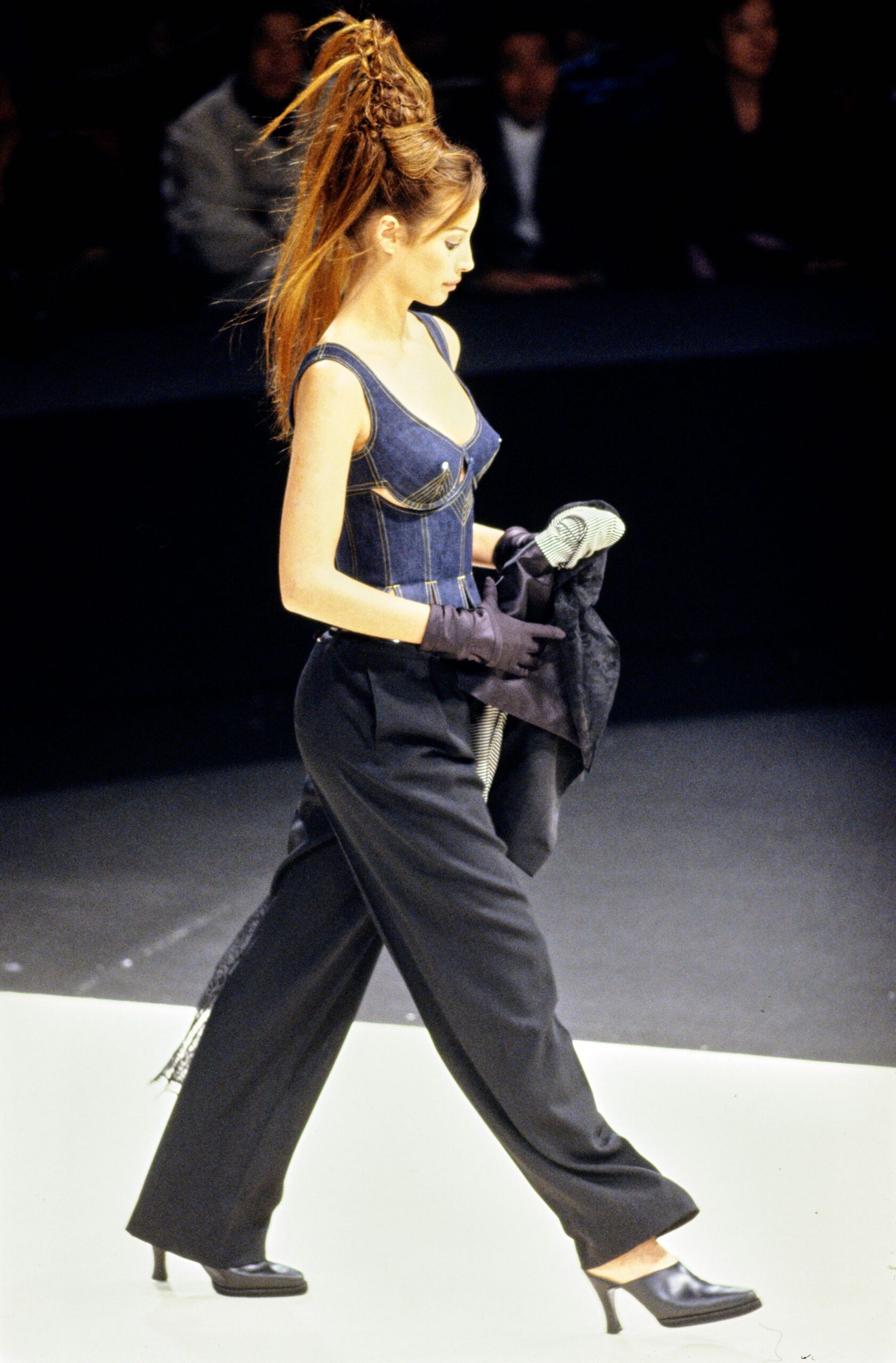 blue denim sleeveless top with black pants