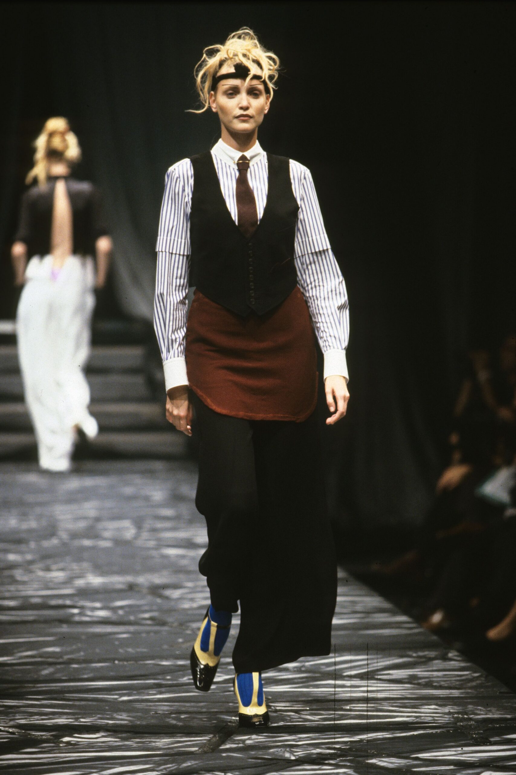 black vest white striped shirt
