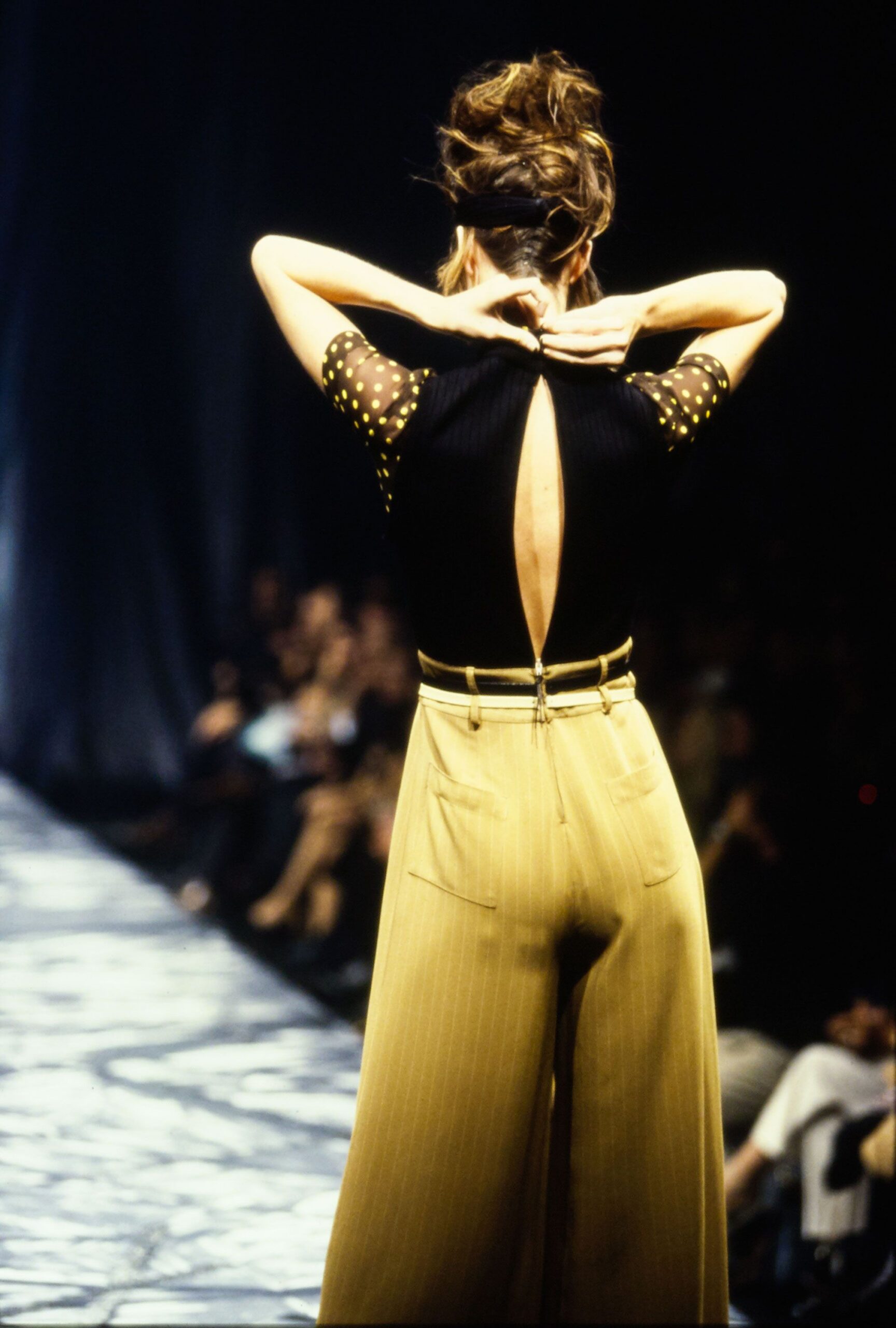 black fitted top with yellow pants