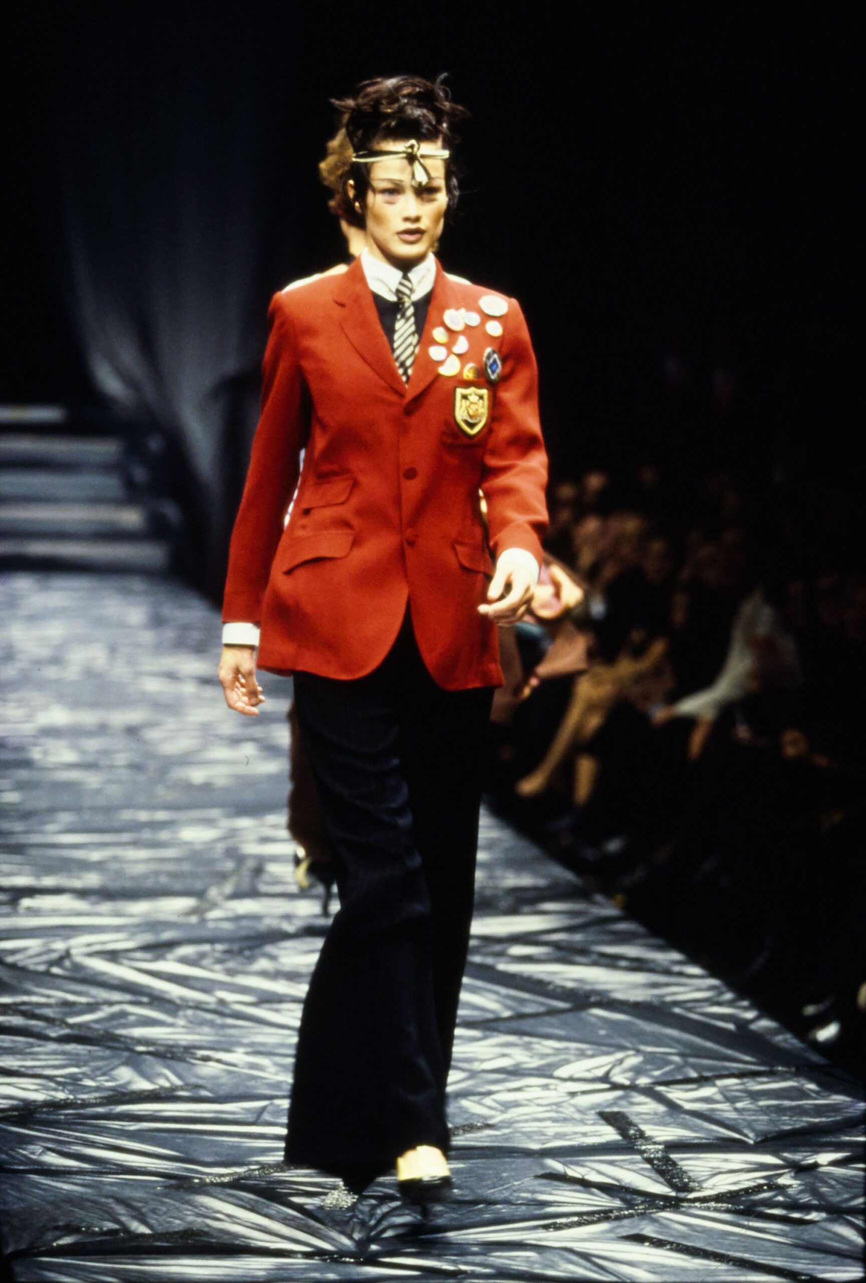 red tailored blazer with black pants