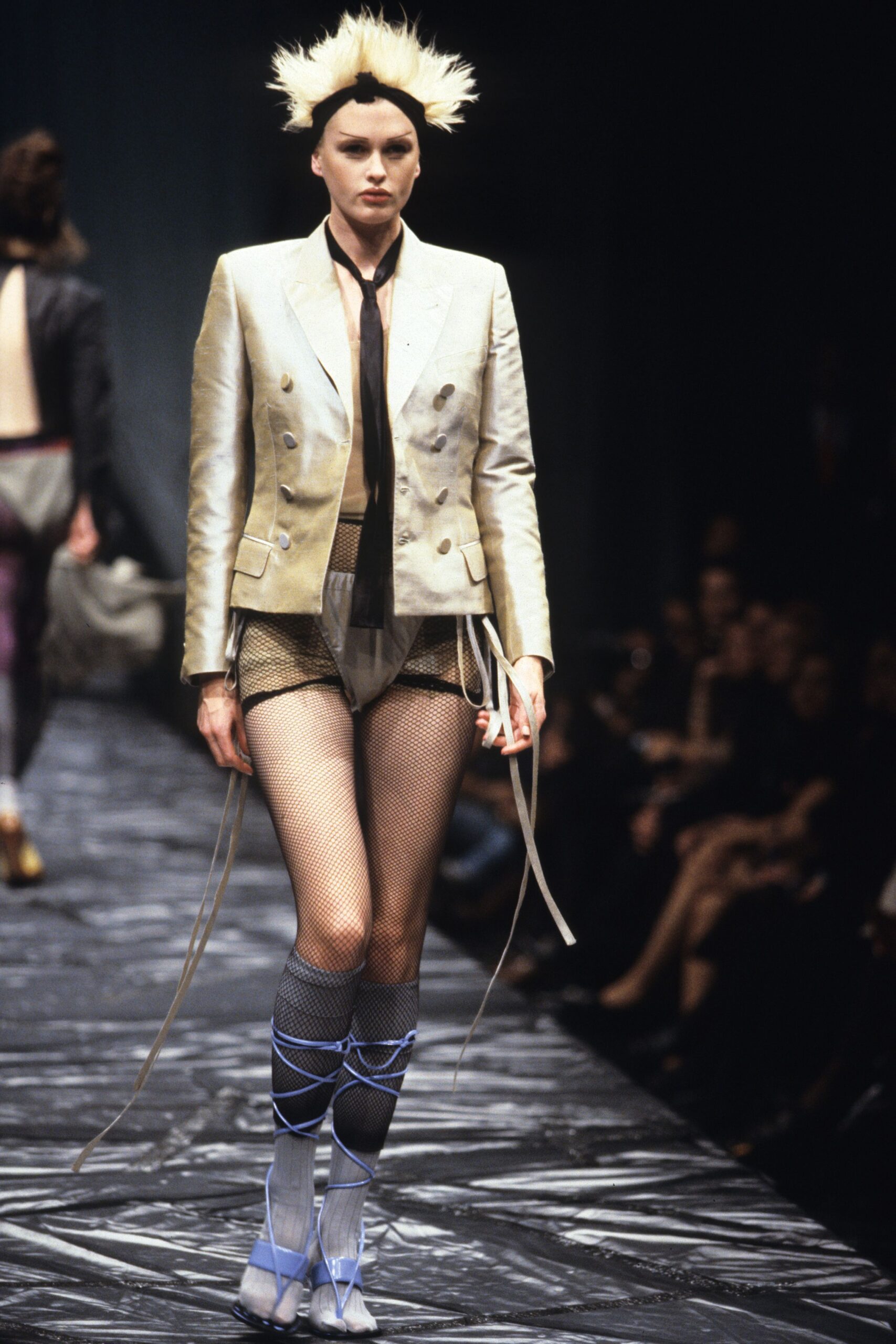 gold tailored blazer with black shorts