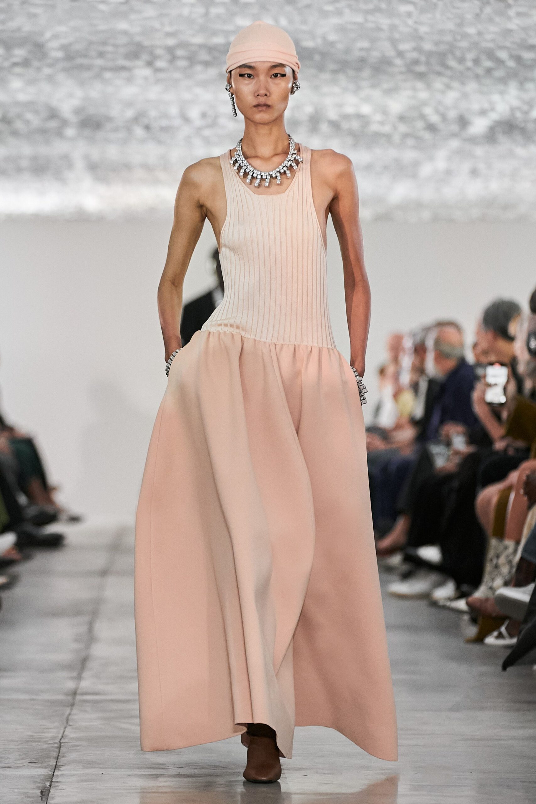 beige cotton sleeveless high-neck fitted pleated a-line dress