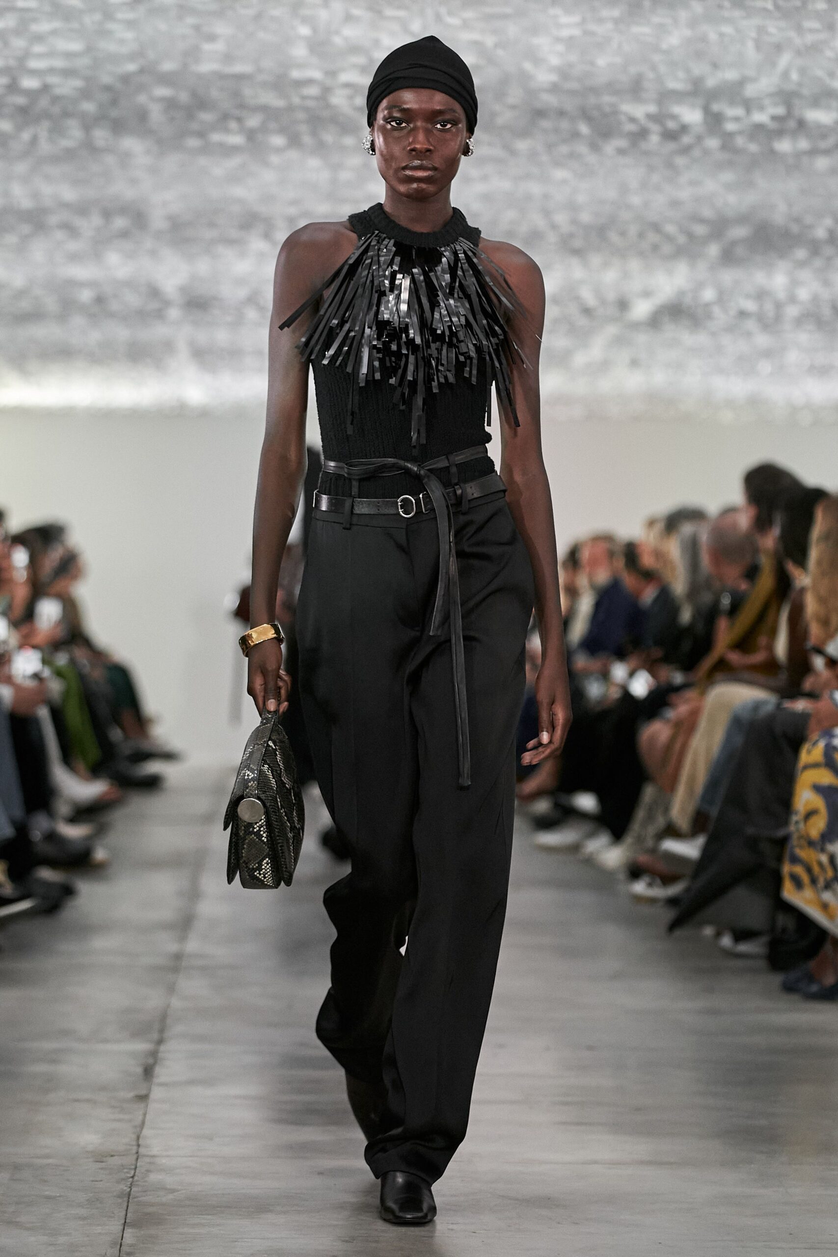 black fringed top with relaxed pants