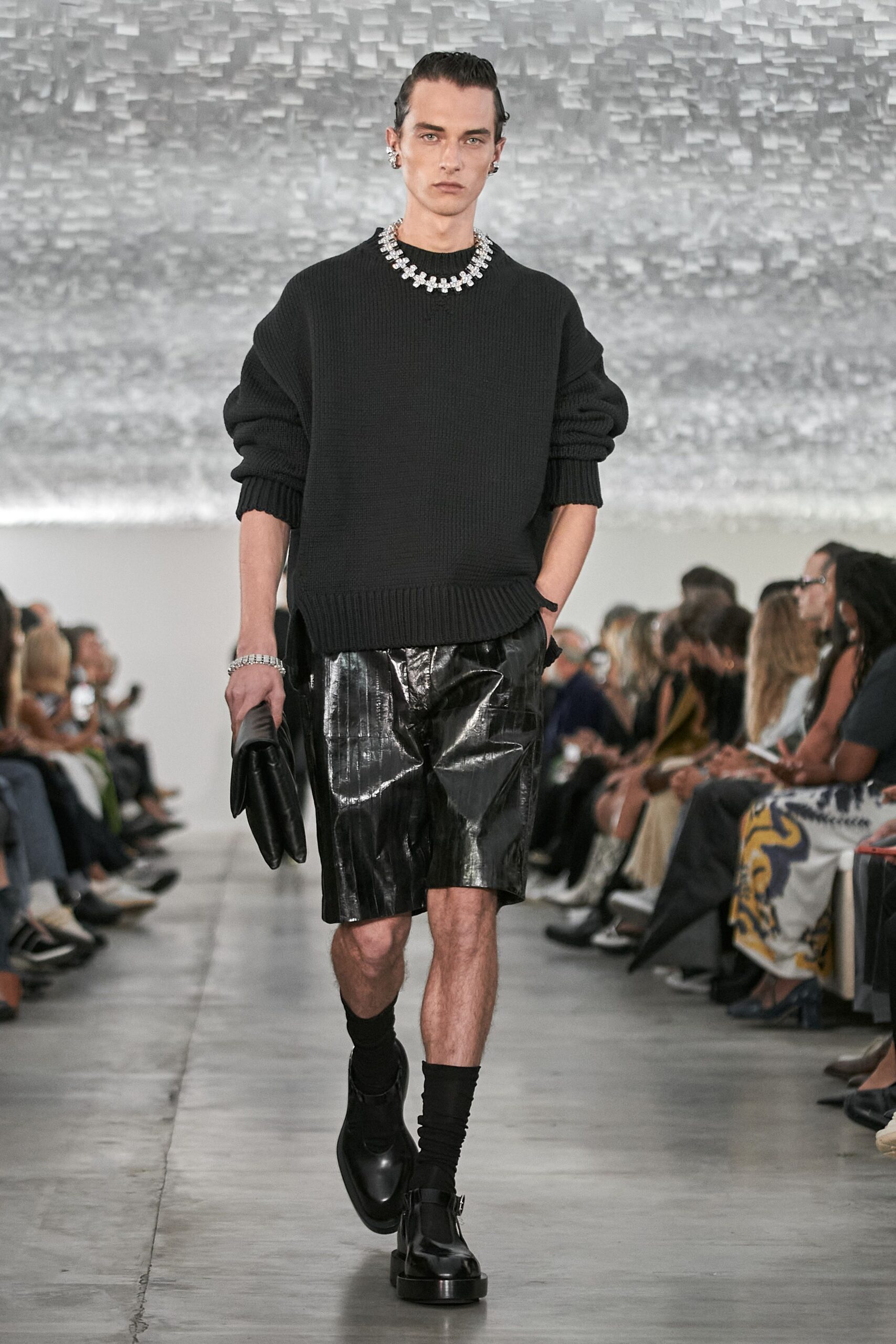 black relaxed sweater with vinyl shorts