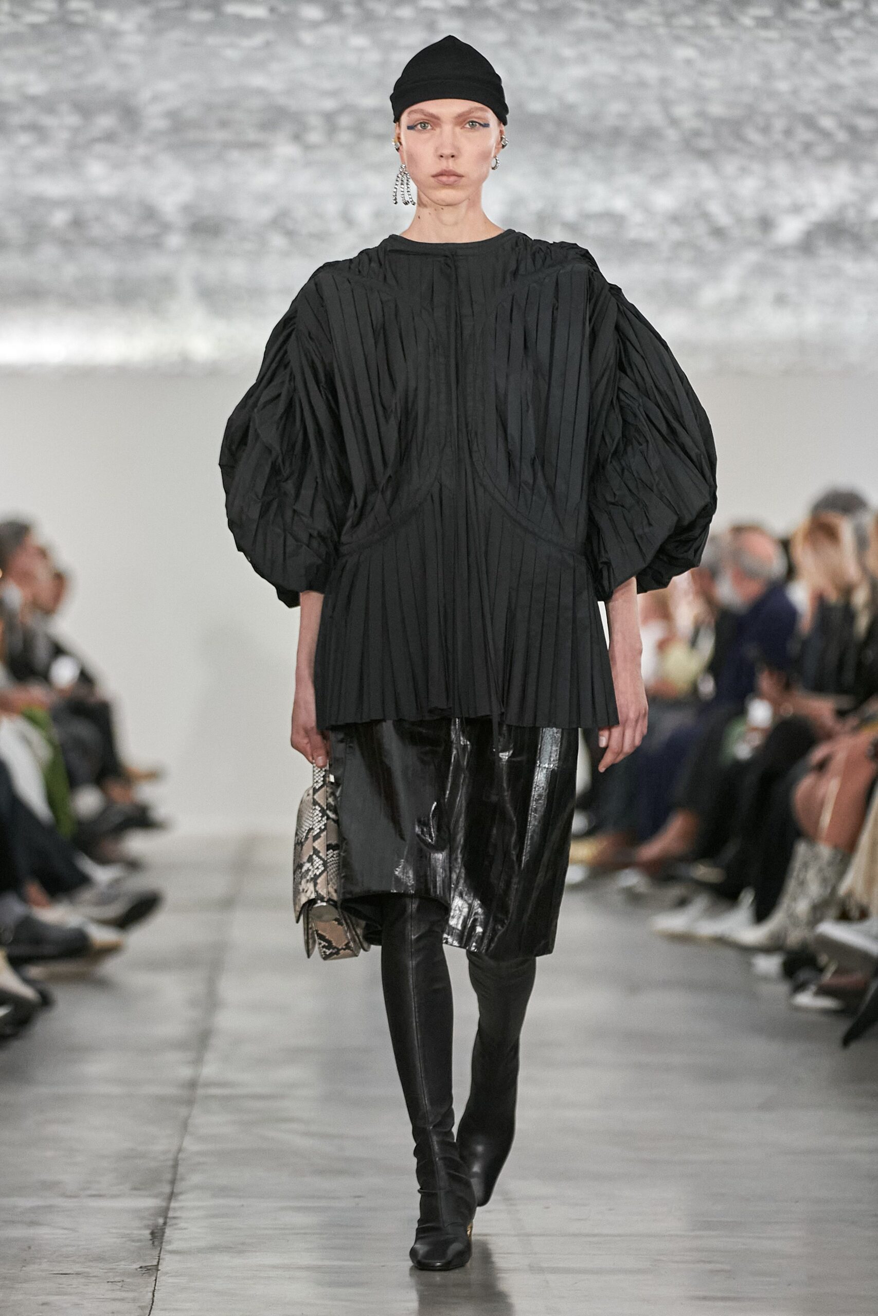 black pleated top with vinyl pants
