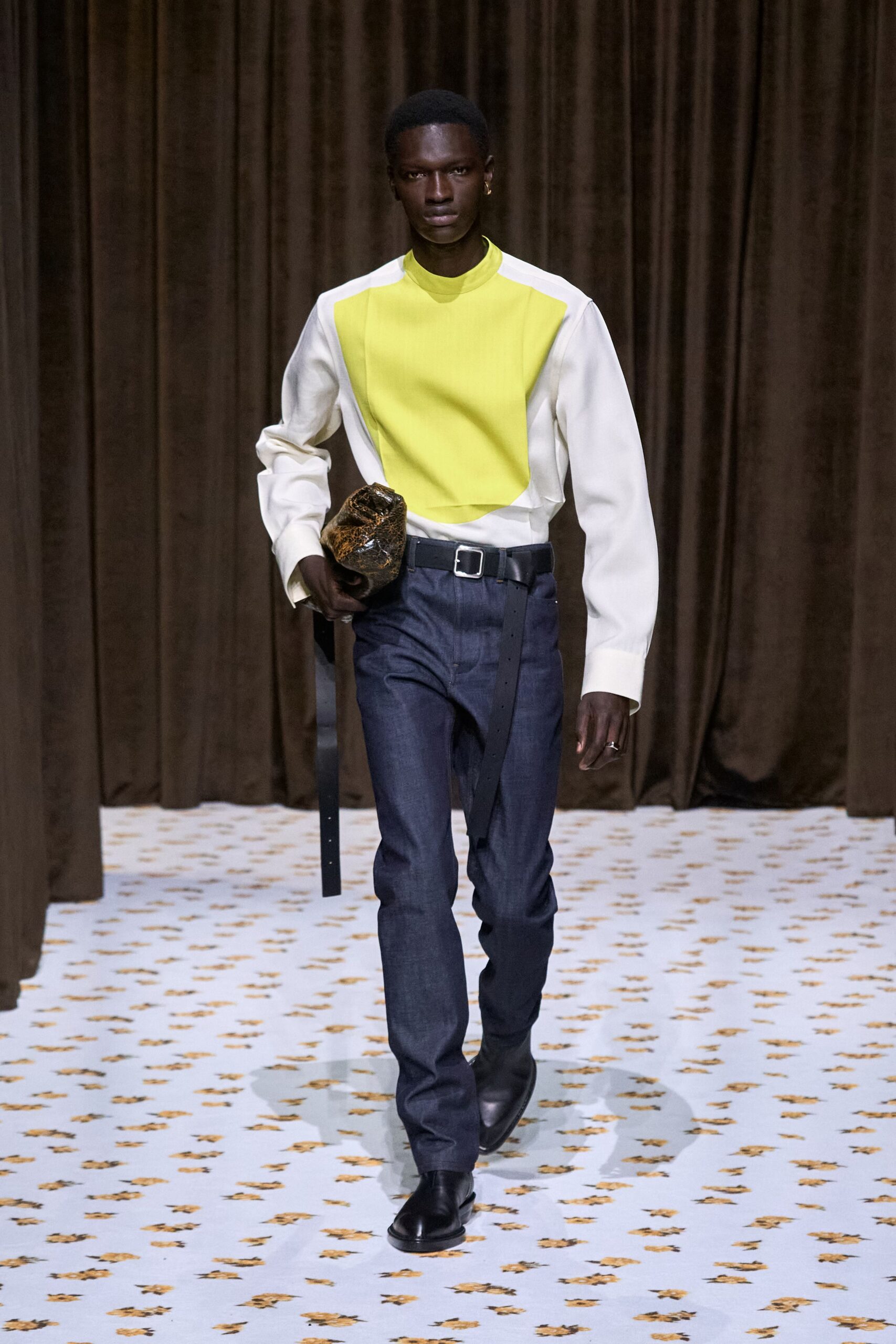 white and yellow shirt with denim pants