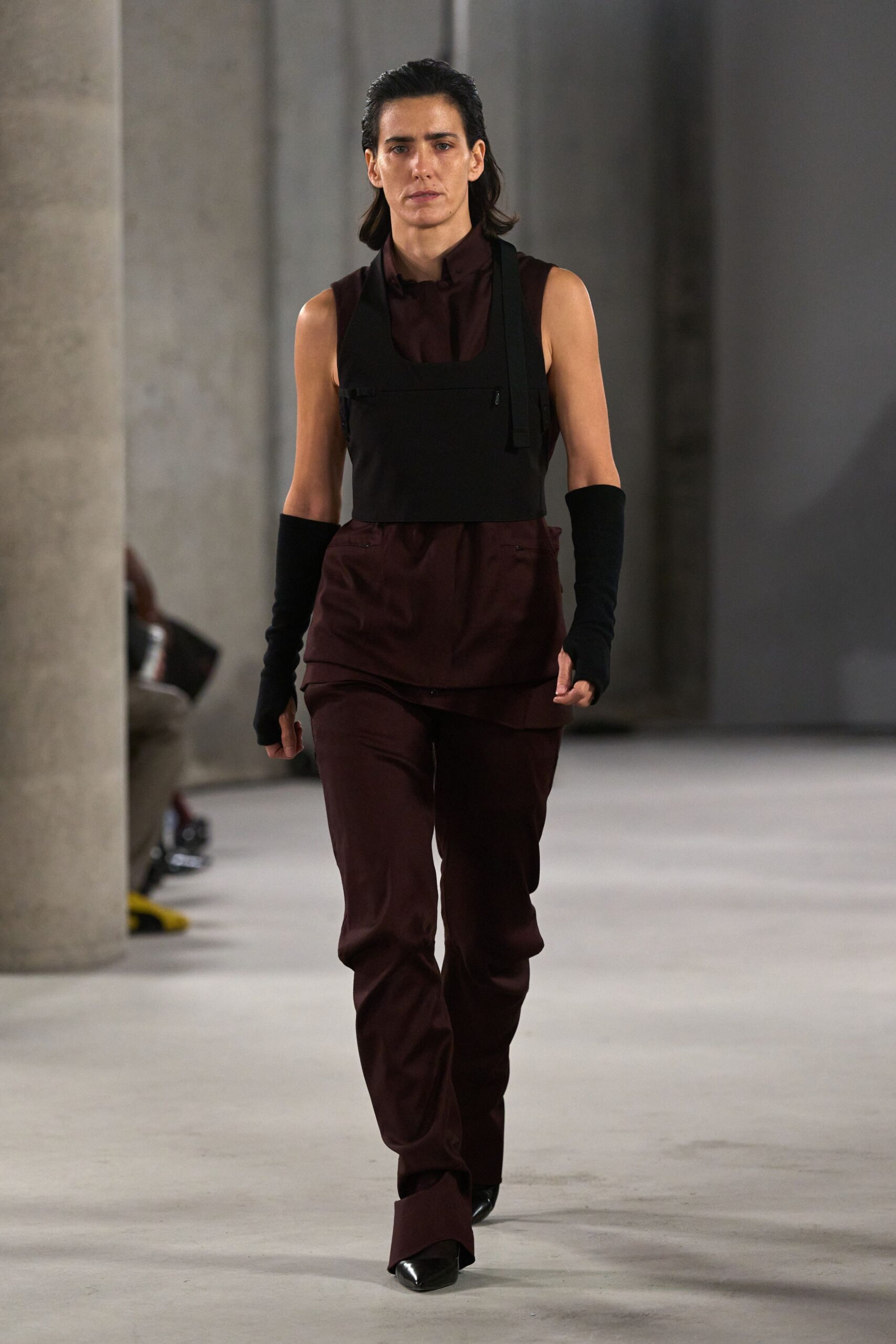 black fitted top with maroon pants