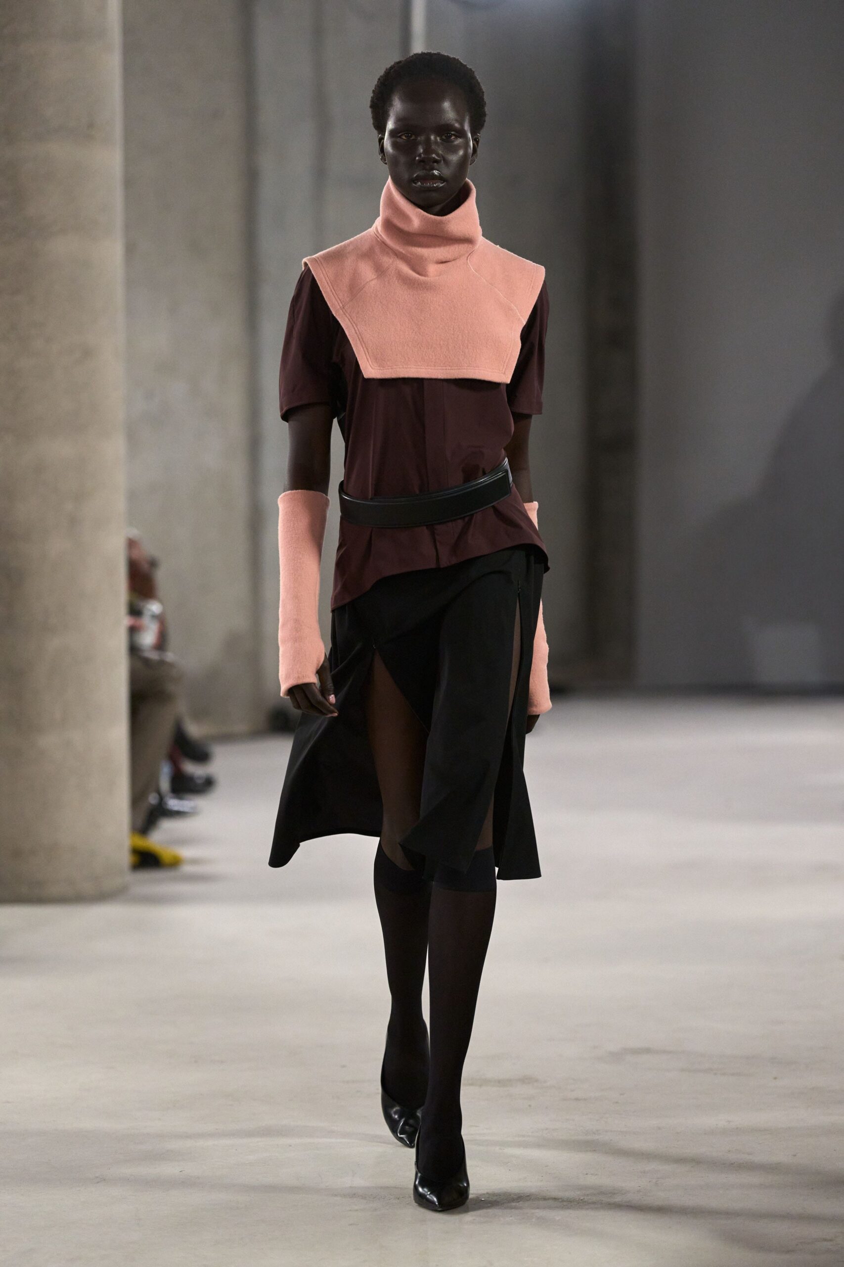 pink and brown fitted top with black skirt