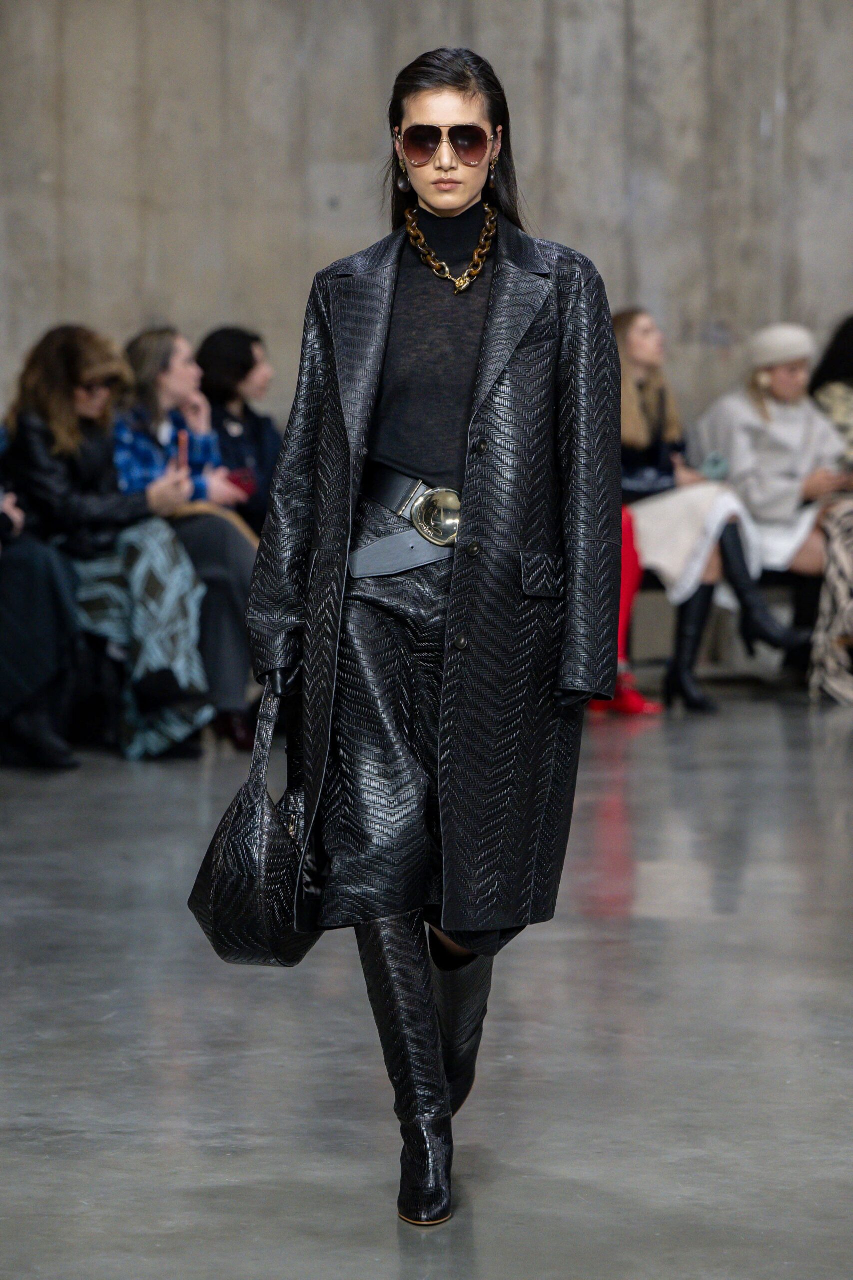 black leather long-sleeve collared relaxed textured coat